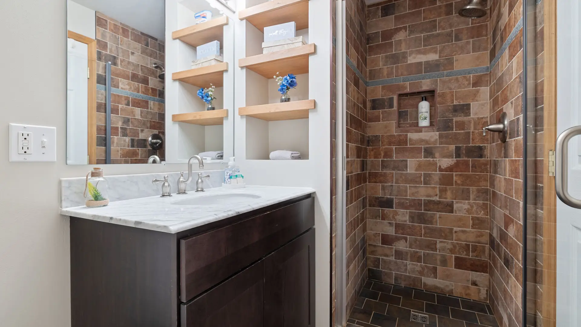 View of the vanity and shower on the lower level of Lake Placid Pinehill Townhouse.