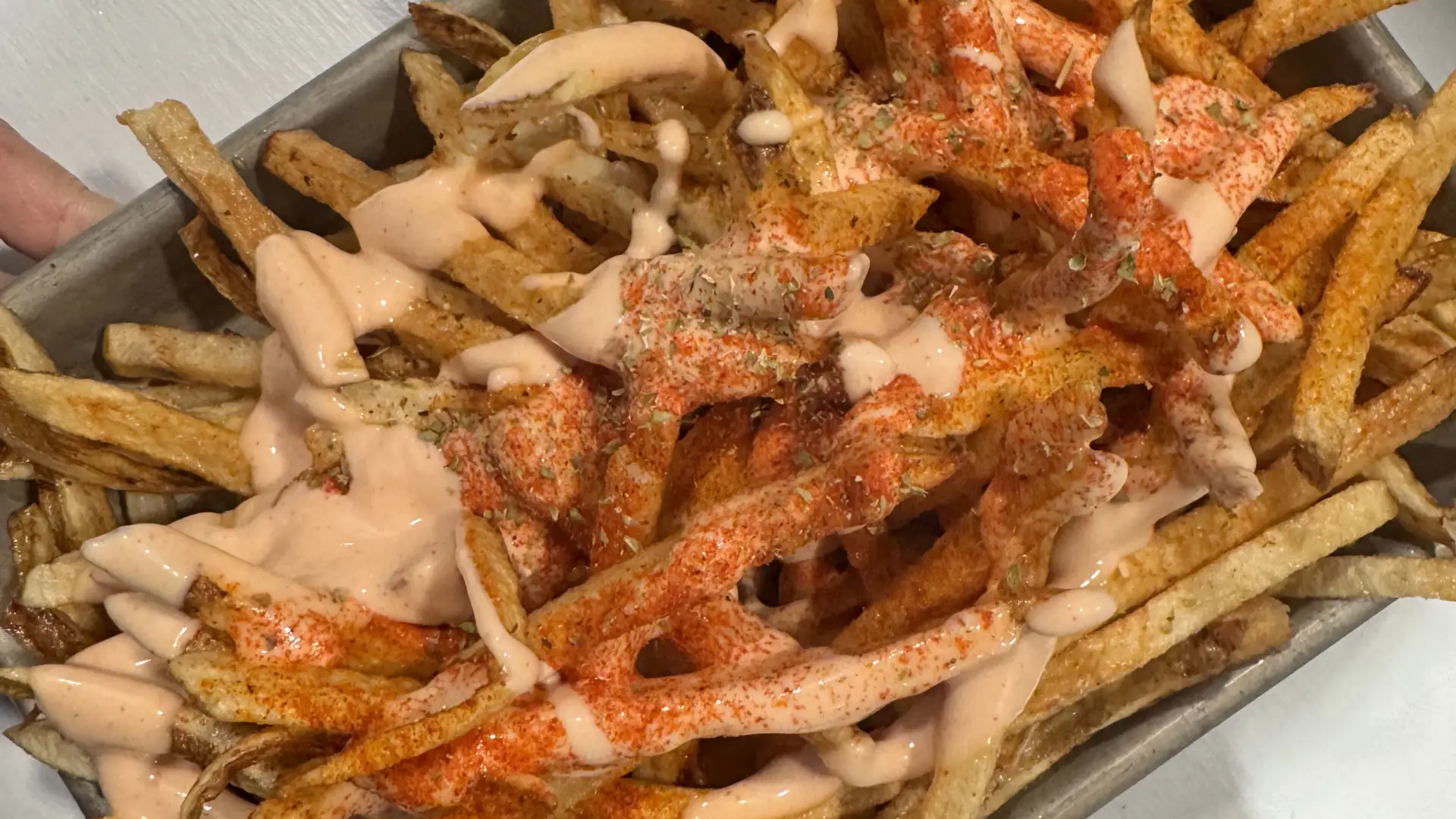 Hand-cut fries topped with House Sauce