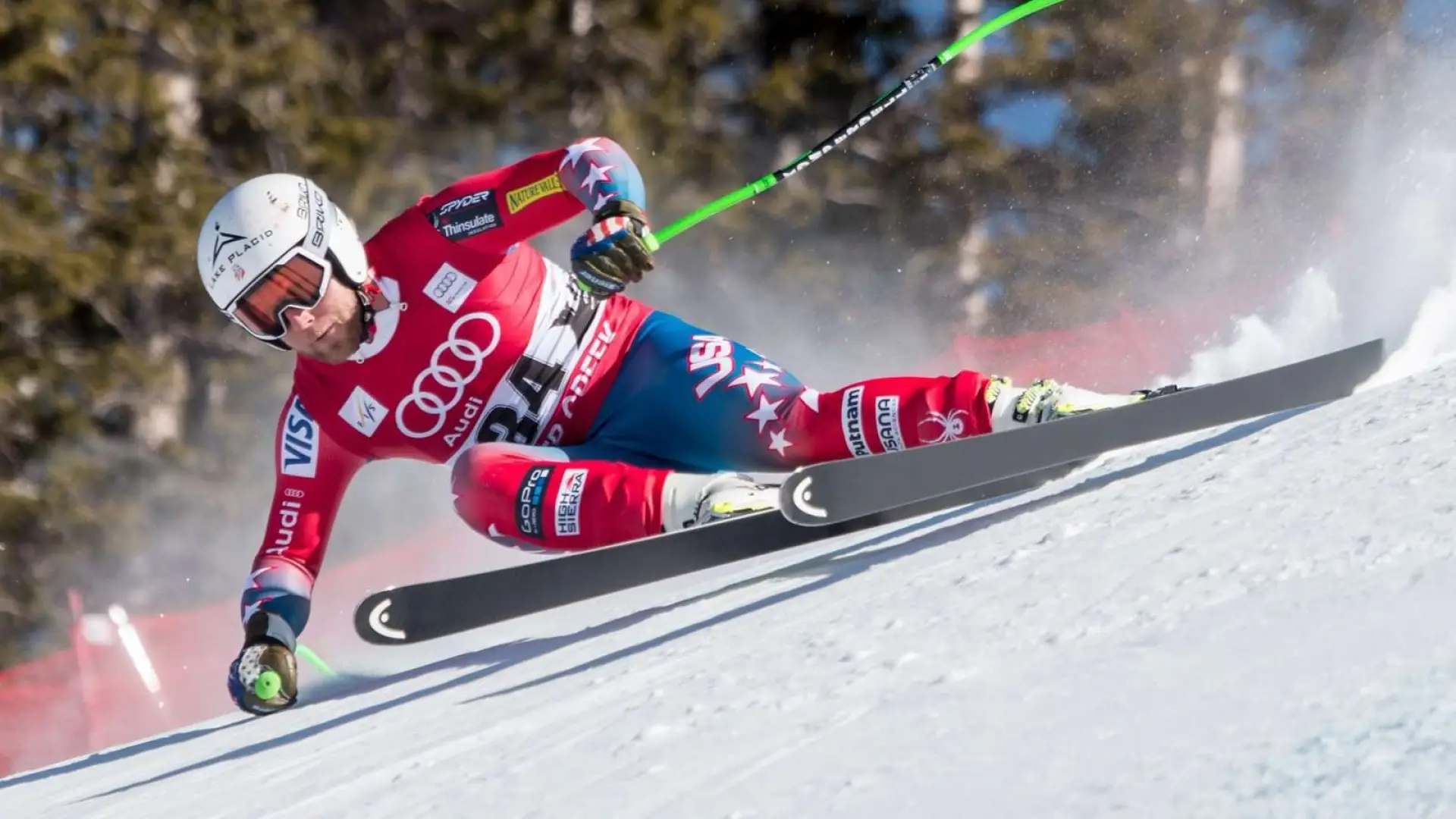 A skier flies down the slopes