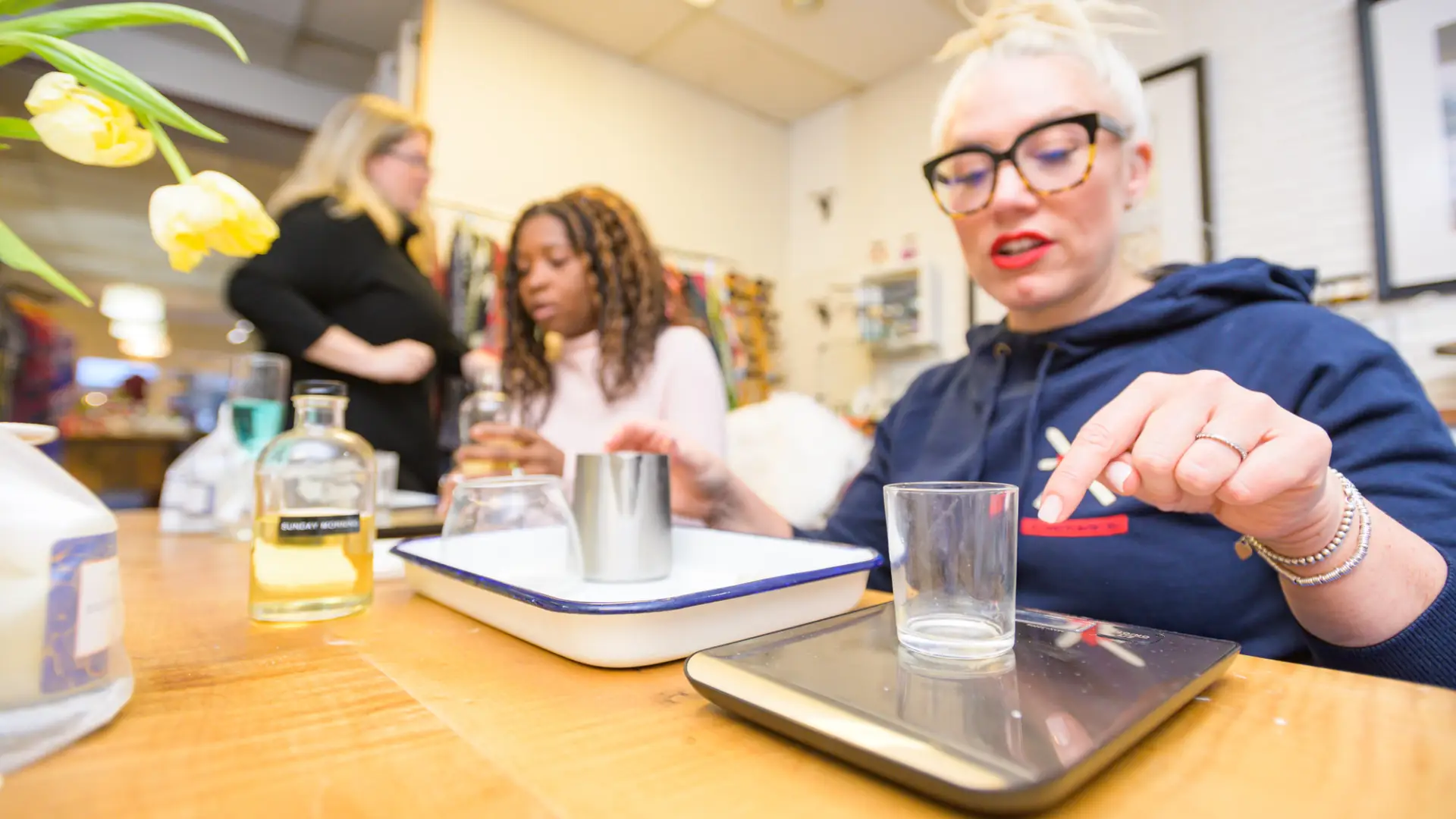 Two women making candles at Pure Placid