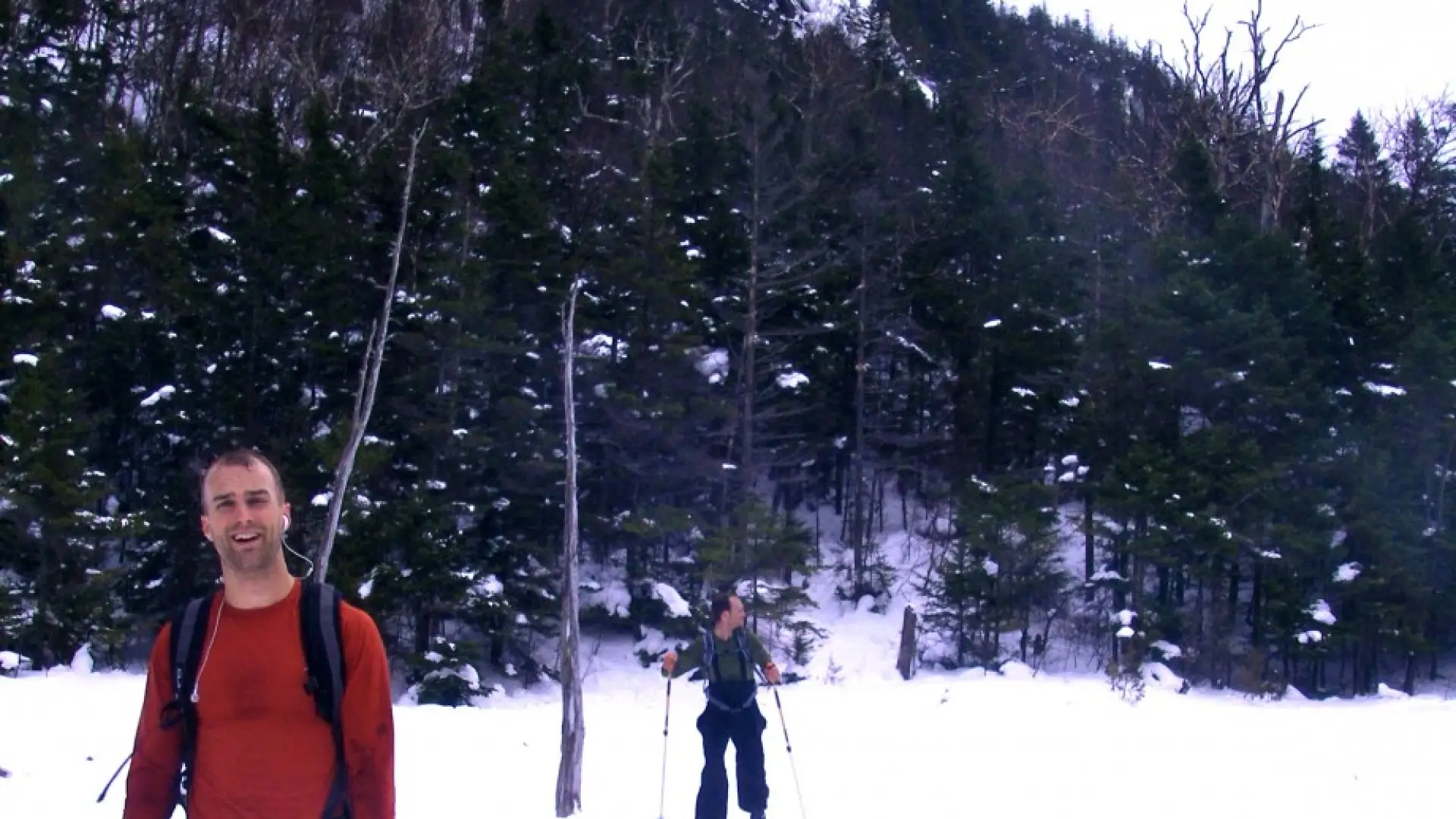 A satisfied skier reaches Avalanche Lake