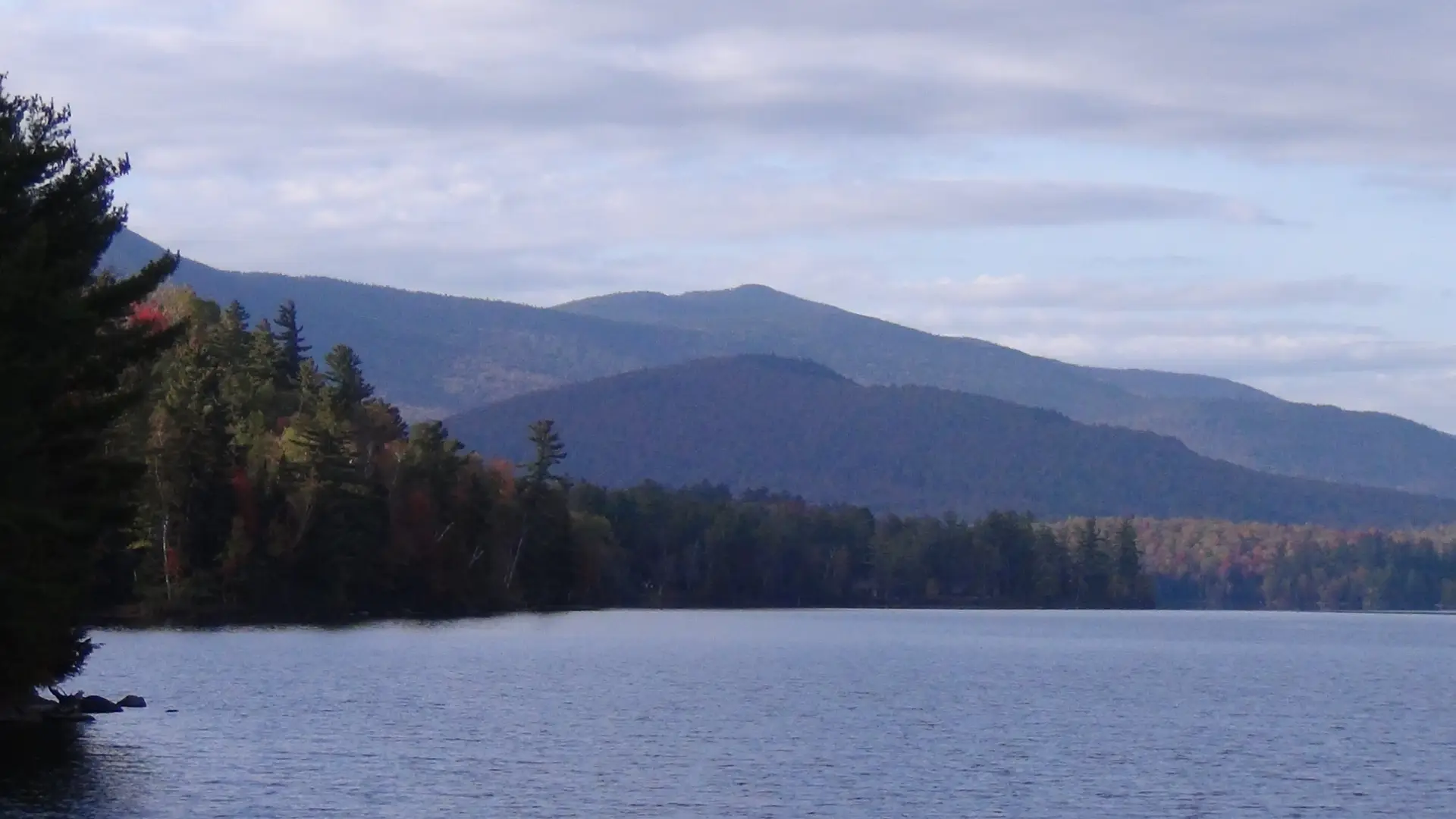 The scenery includes a mountain range.