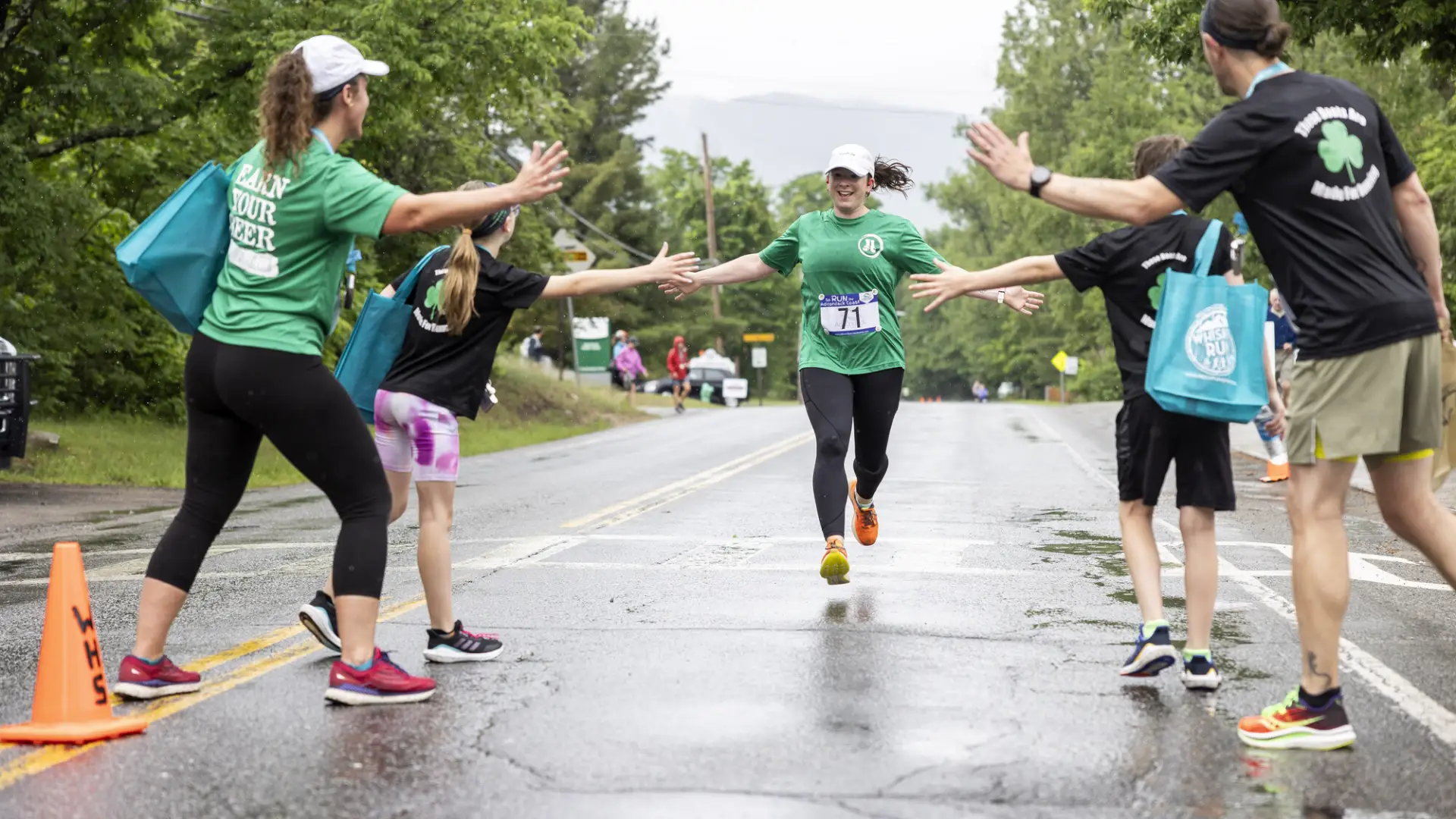 Runner gives high fives while racing