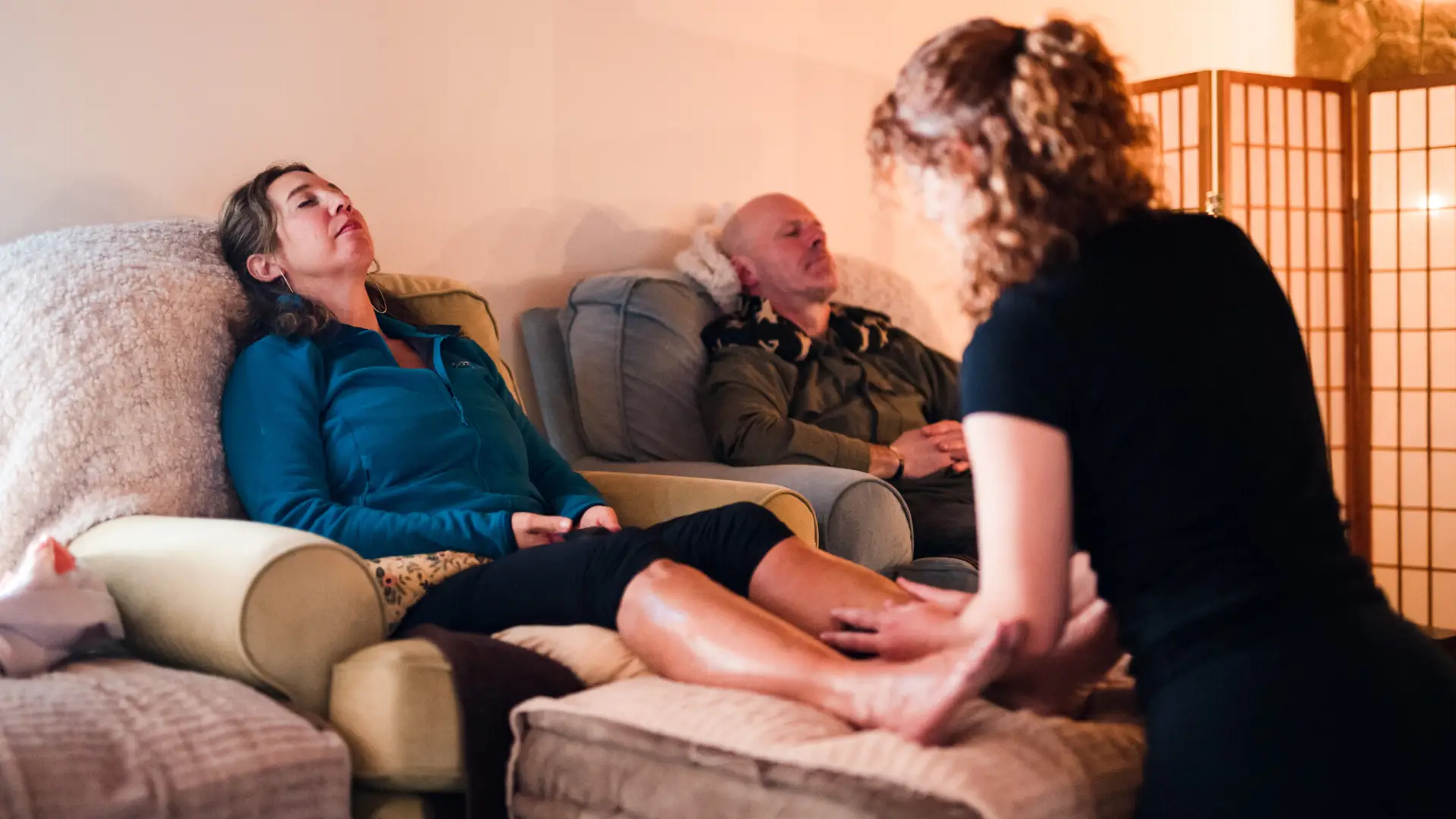 A woman has her feet massaged at a spa.