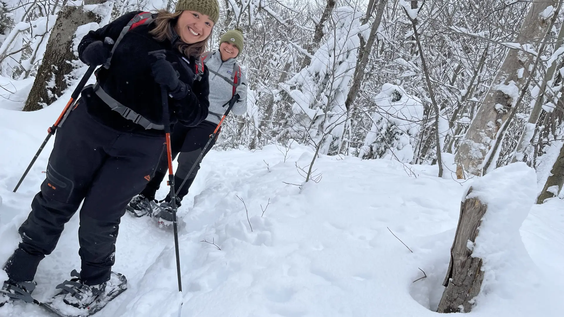 Smile into the camera on the snowshoe trail