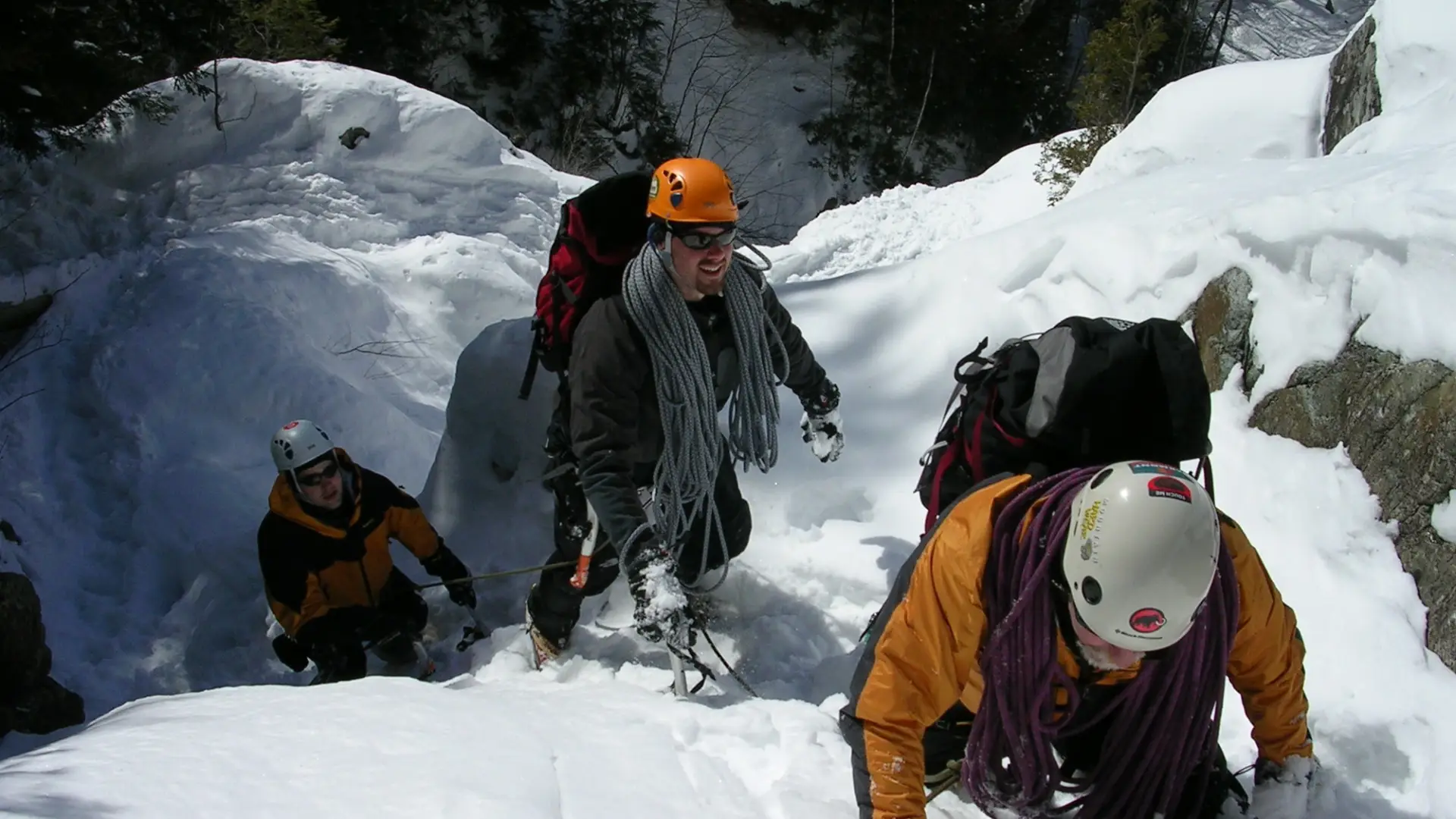 A group of ice climbers moving up easy terrain