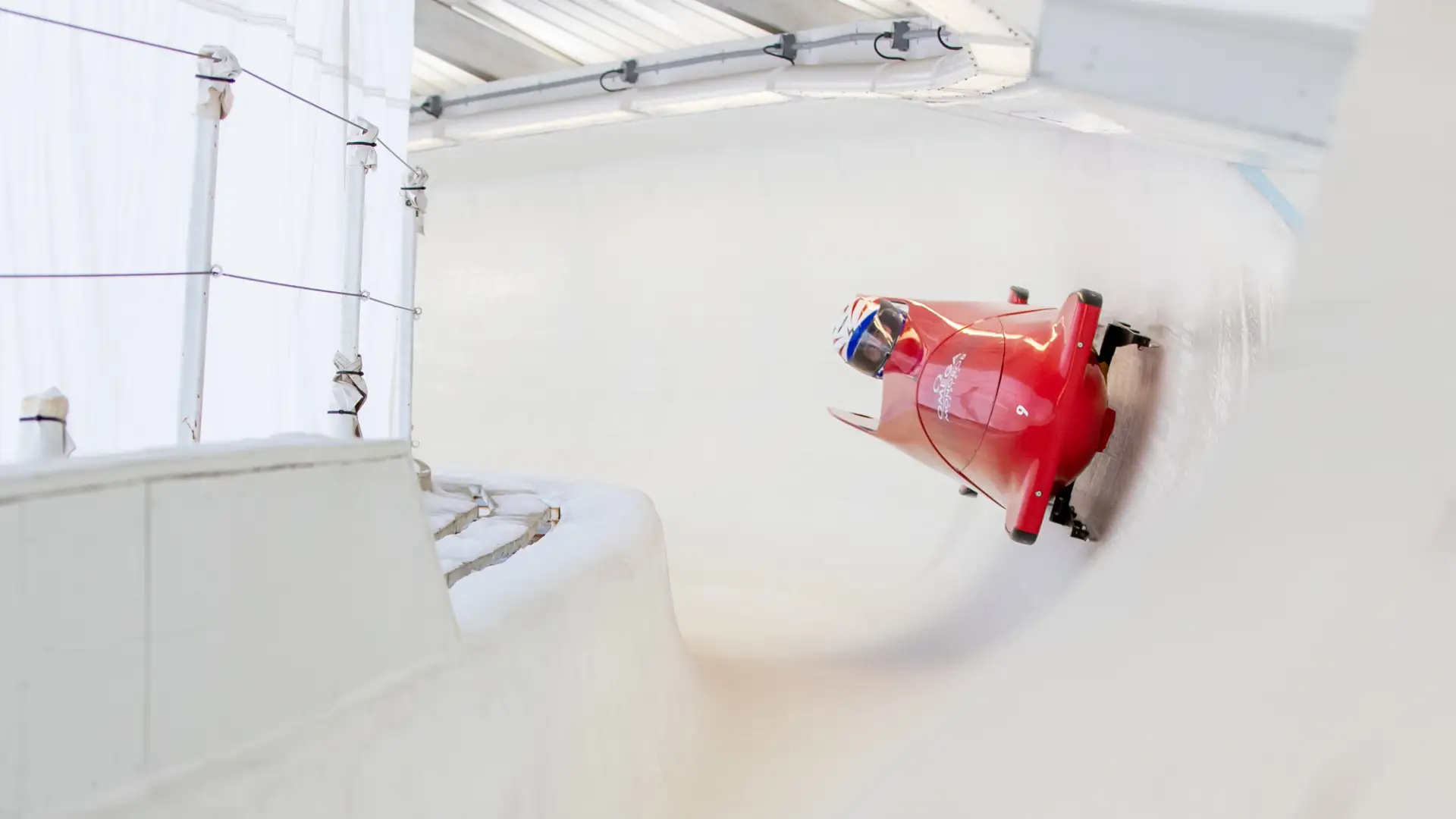 An adaptive bobsledder makes his way down the bobsled track in Lake Placid