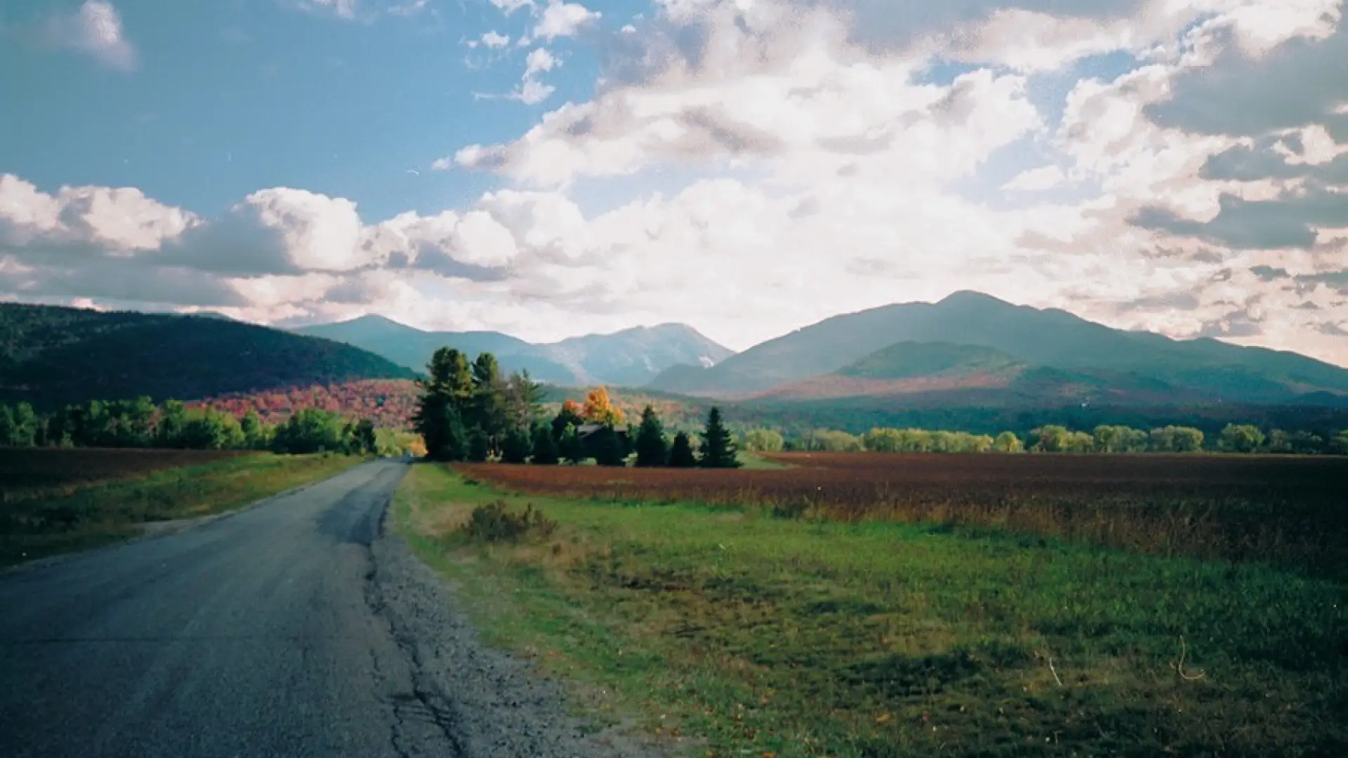 A view of mountains in the fall from a road