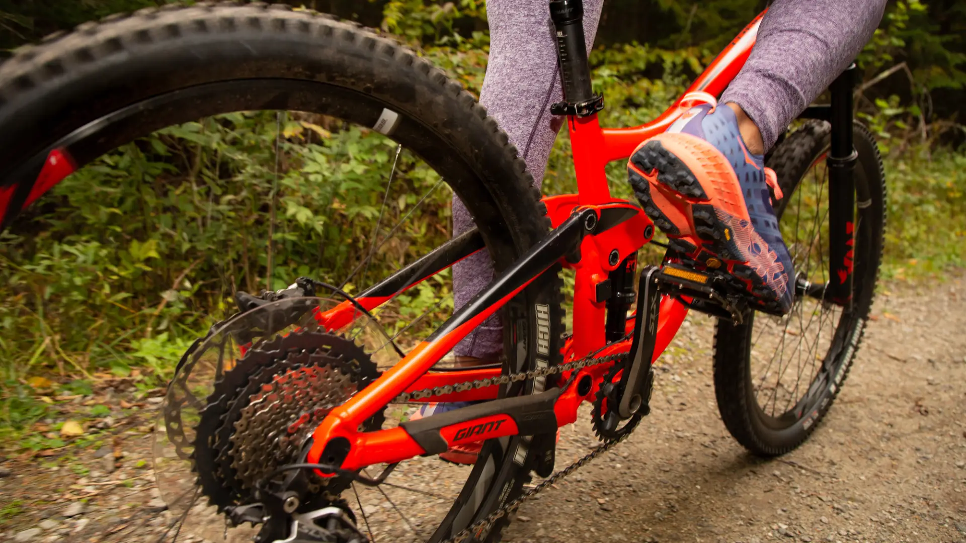 a close up shot of someone peddling on a bicycle.