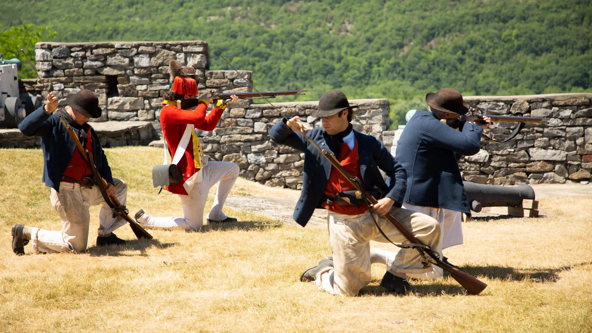 Revolutionary war reenactors firing a cannon