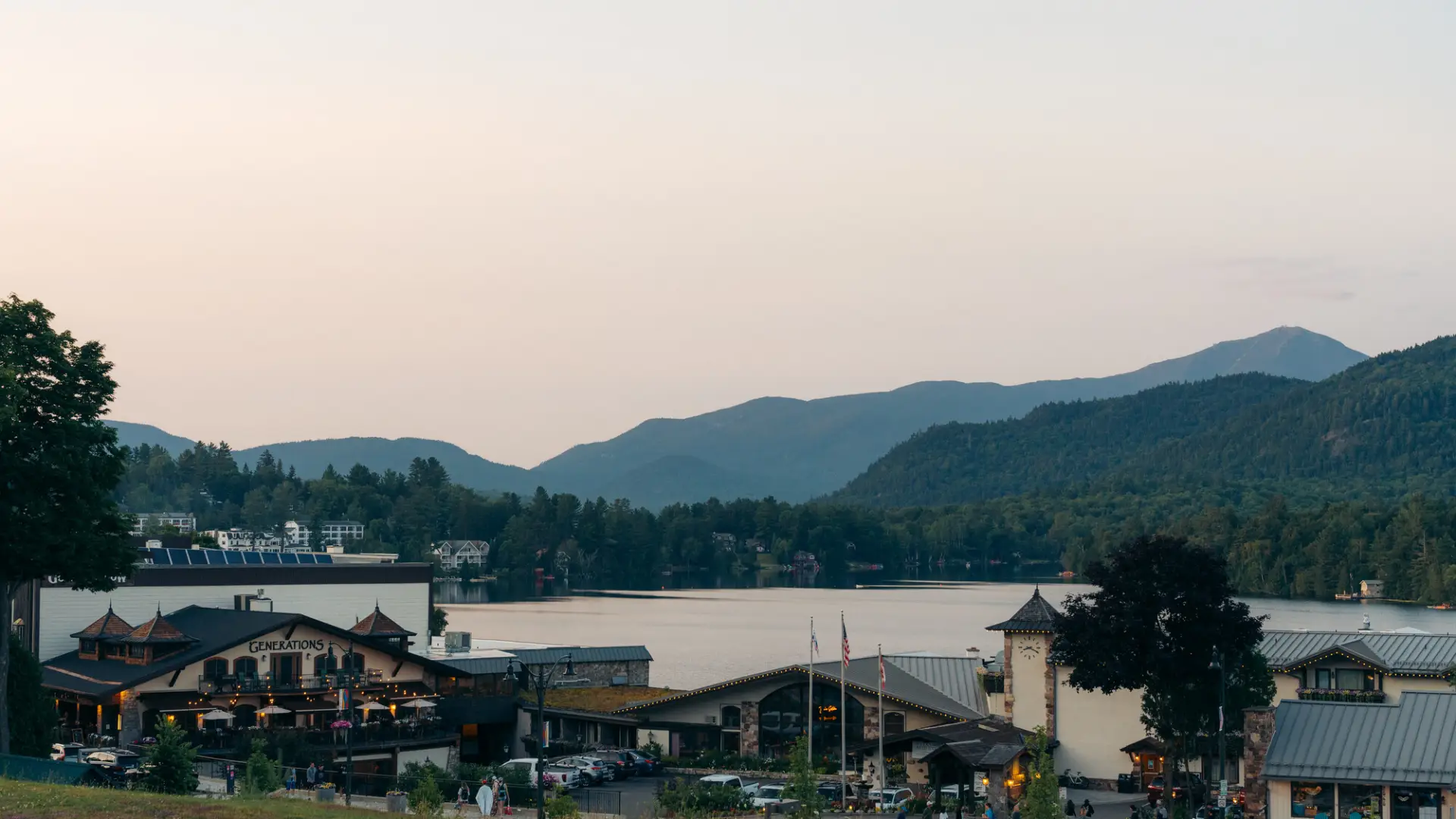 A view of Generations restaurant at sunset with Mirror Lake in the backgound.