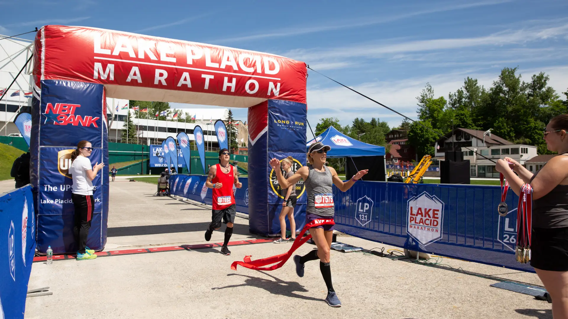 Runner crosses the finish line of the Lake Placid Marathon