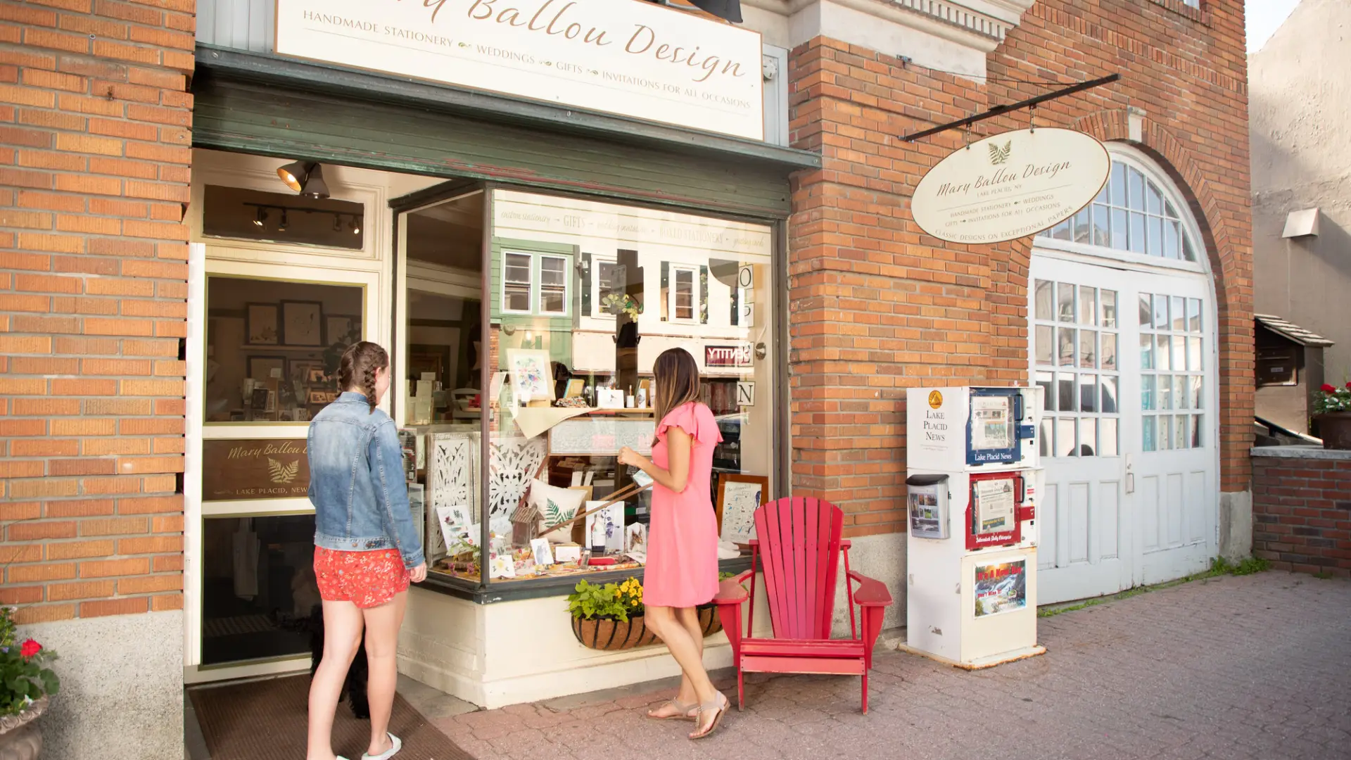 Two women browse Lake Placid's Main Street in the summer.