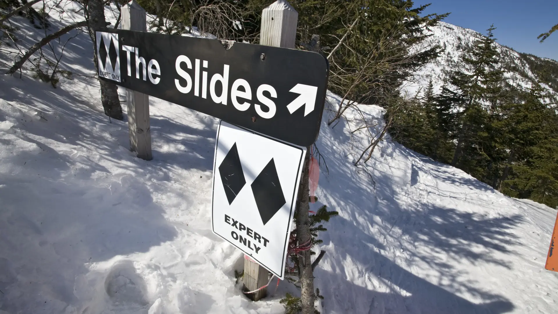 A sign for a double-black ski run.
