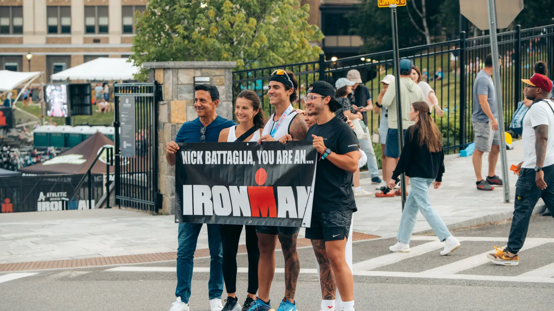Family celebrates Ironman athlete finish with banner