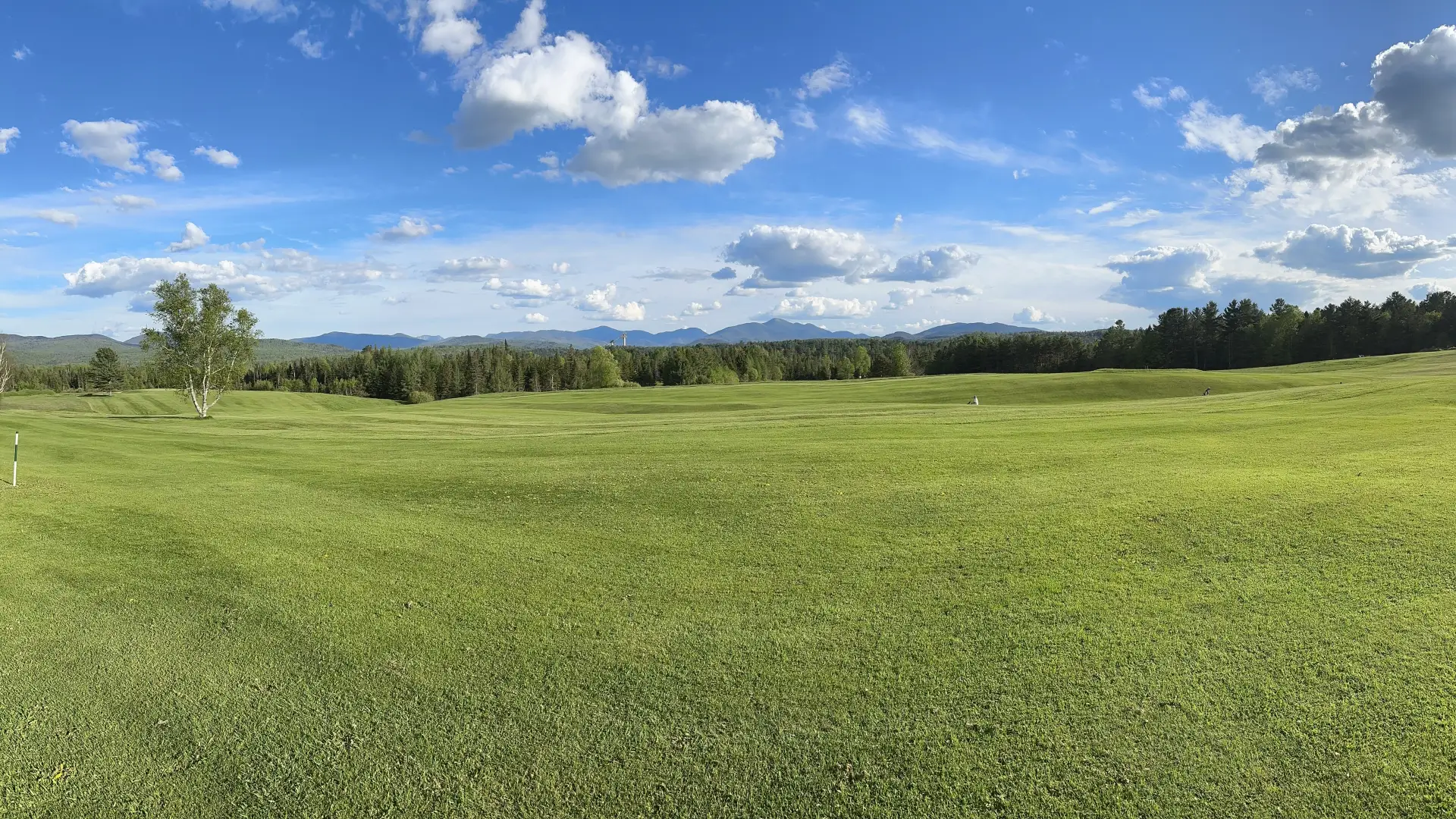 Mountain views from a lush and beautifully maintained fairway on at The Lake Placid Club.