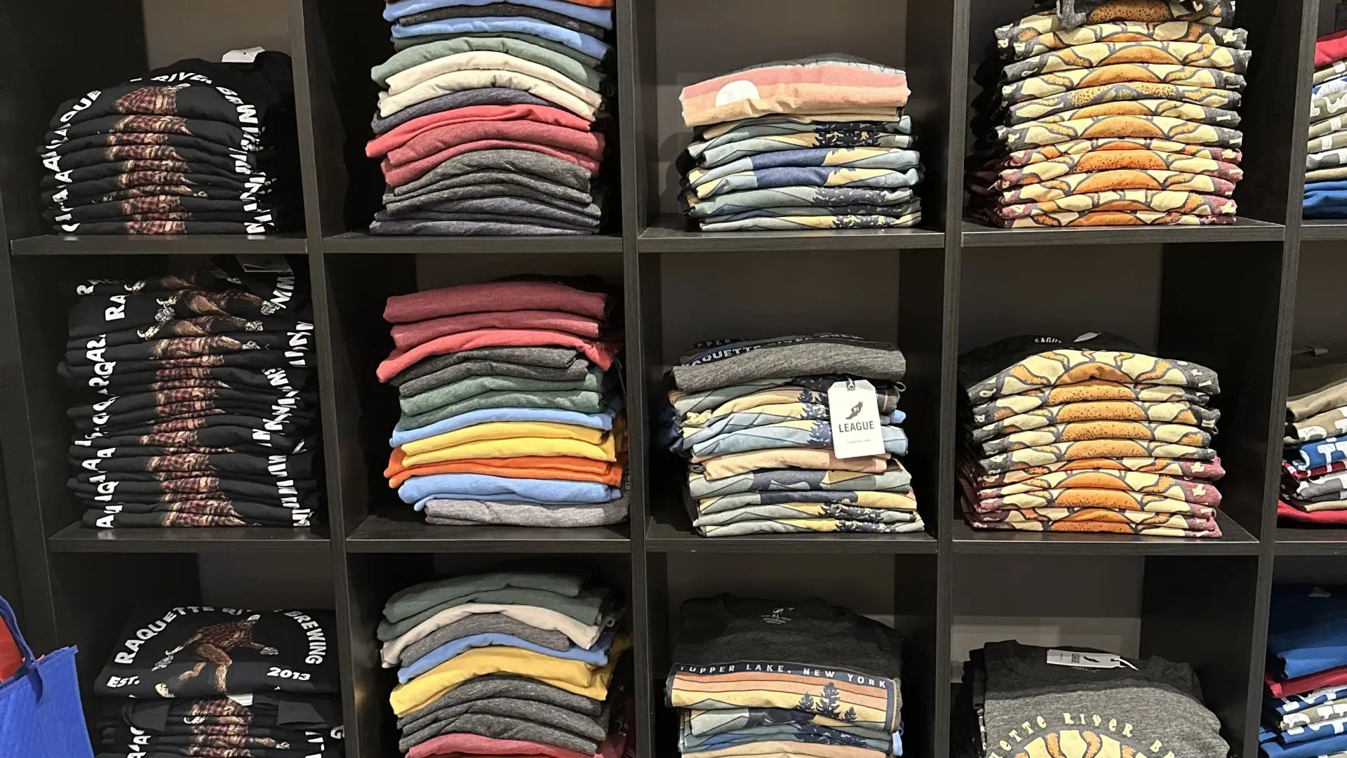 Shelves of branded shirts