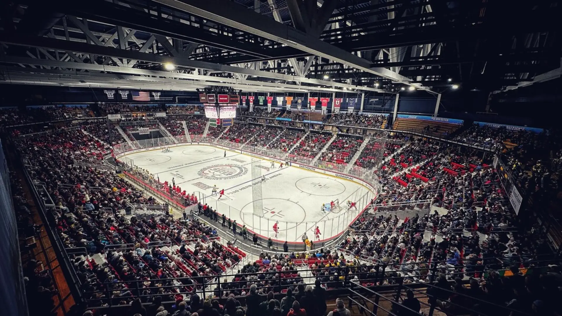 1980 Herb Brooks Arena looking down at the ice set up for a hockey game with a full crowd in the seats