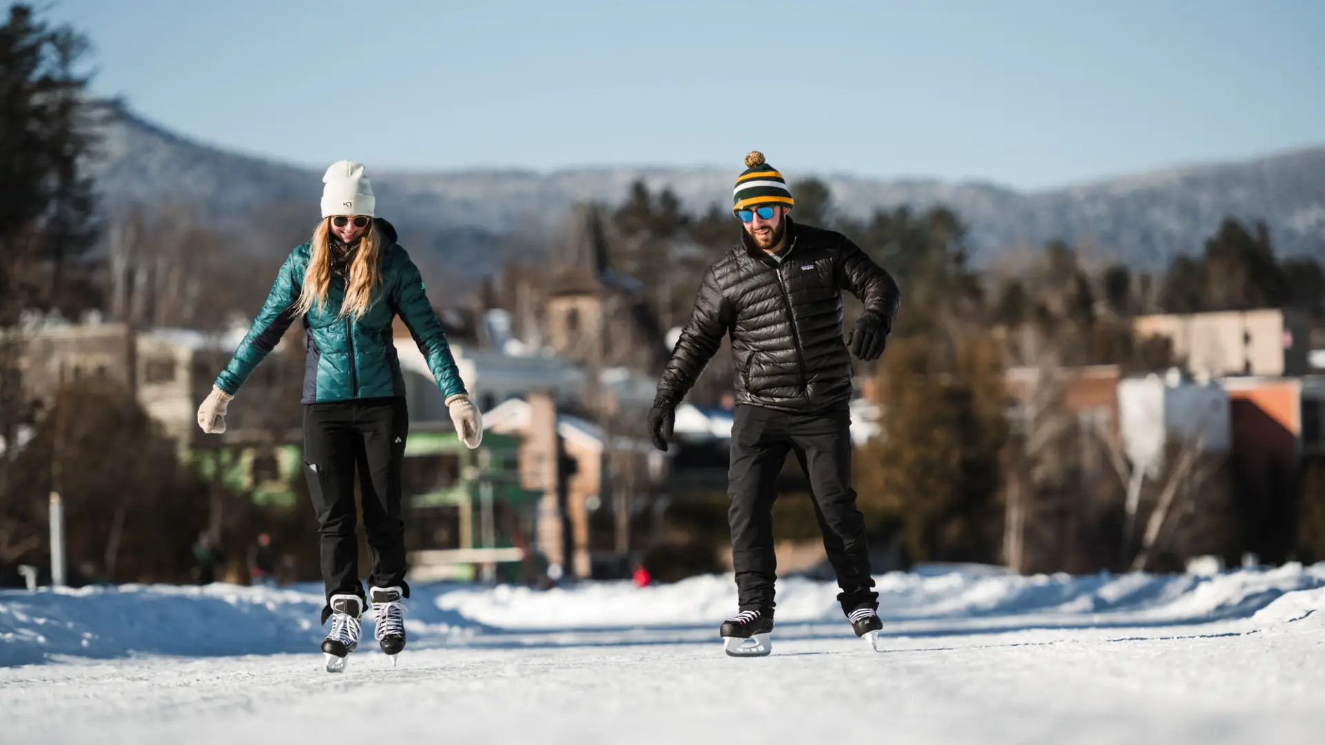 Couple skating on frozen lake