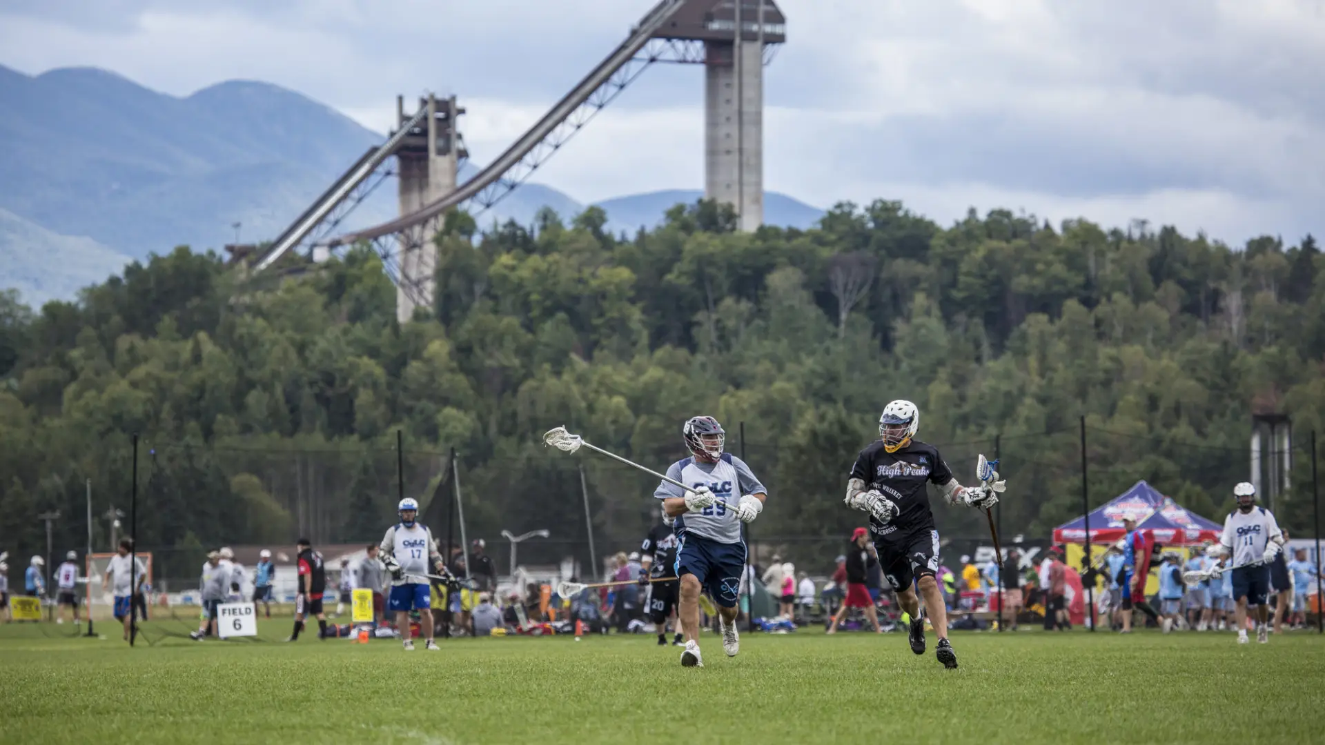Two men fight for a ball in lacrosse. 