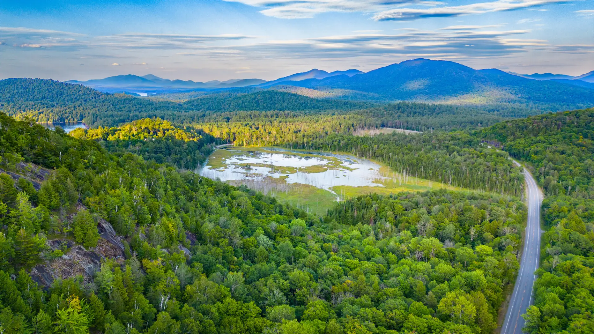 Adirondack scenic drone image, mountains in the background