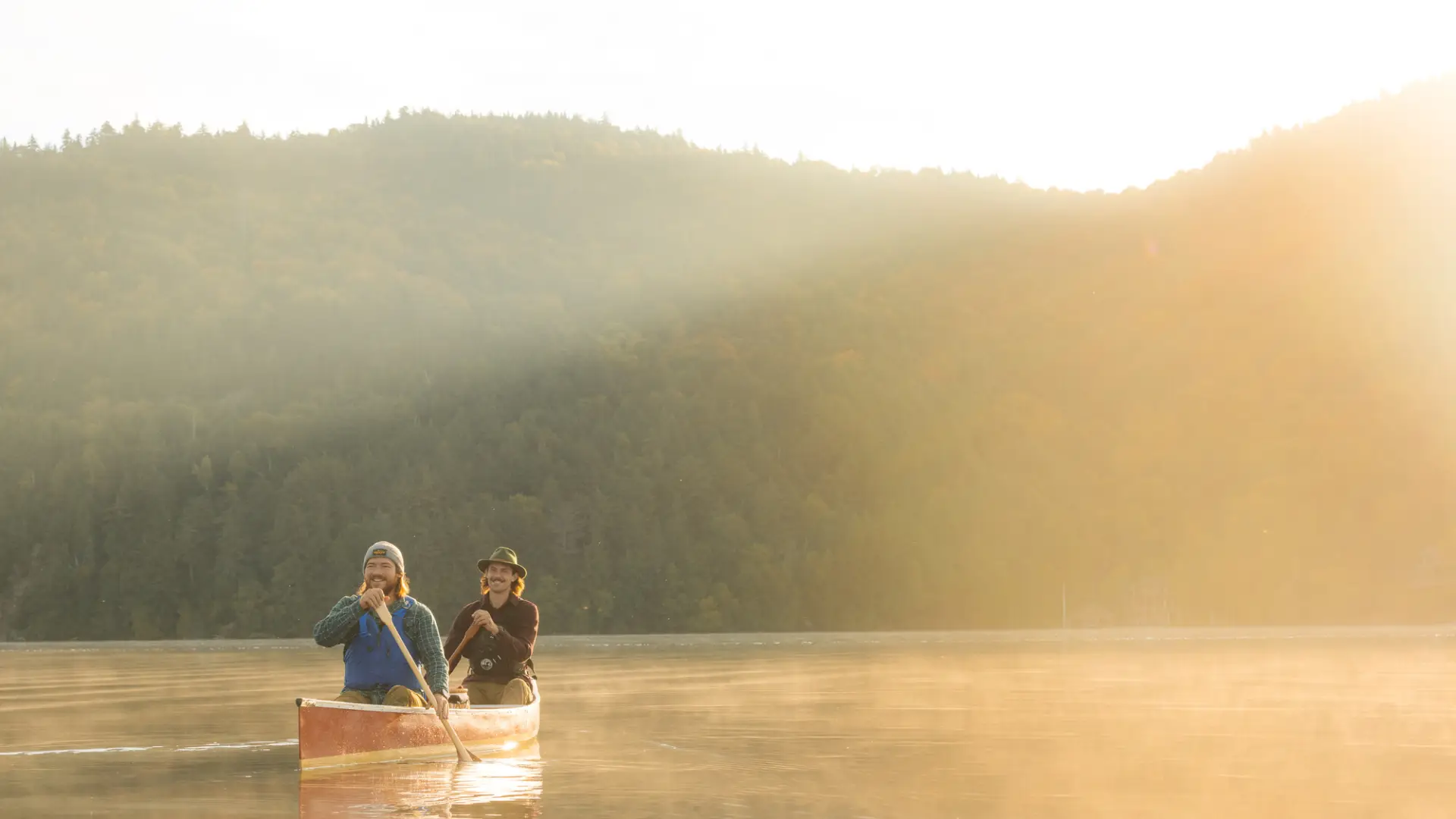 Two people in a canoe during the spring