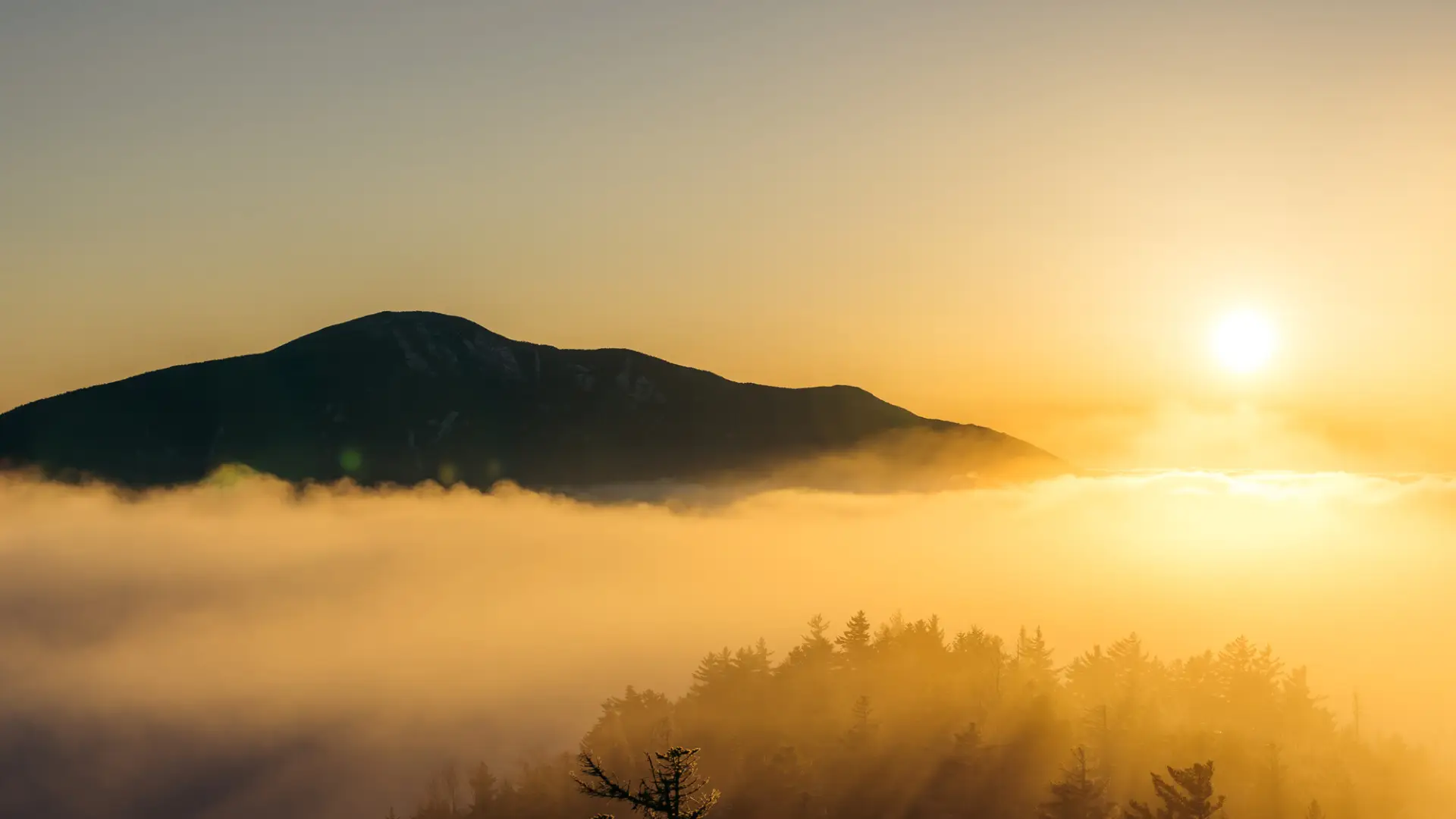 The sun rising over Giant Mountain.
