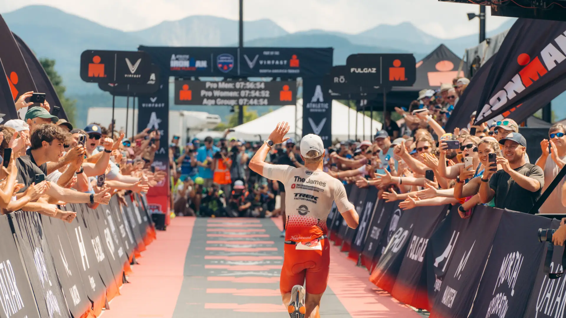 A man runs to the finish line of the Iron Man Race. 