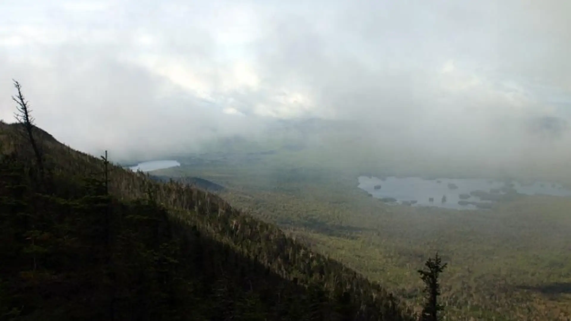 A view of a large lake from high up in the mountains