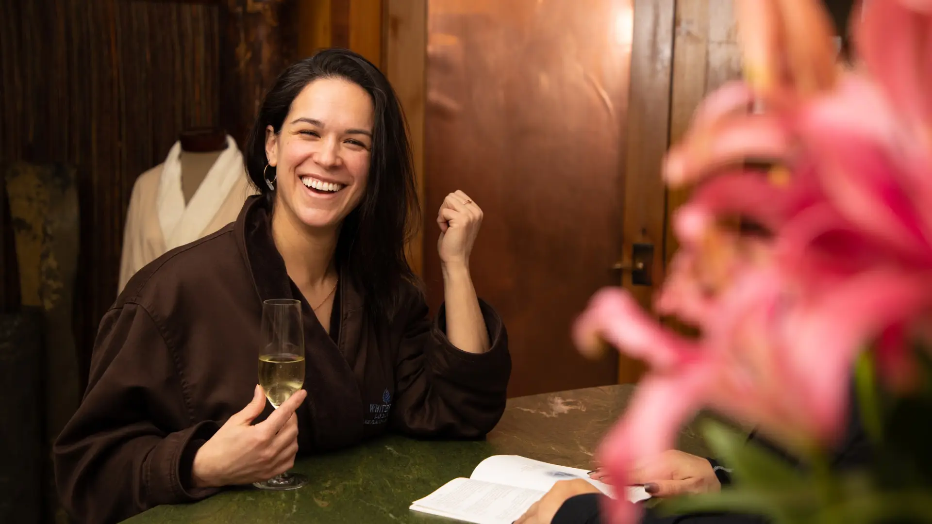 A woman checking in at a spa in Lake Placid.