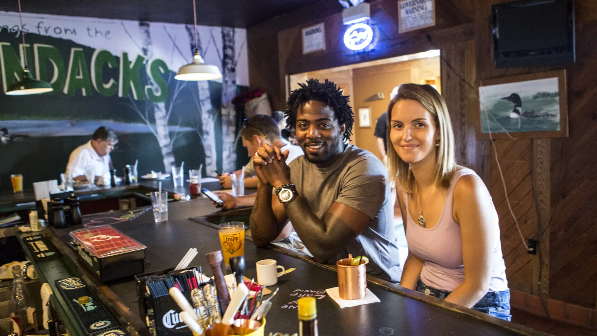 two people eating at the bar