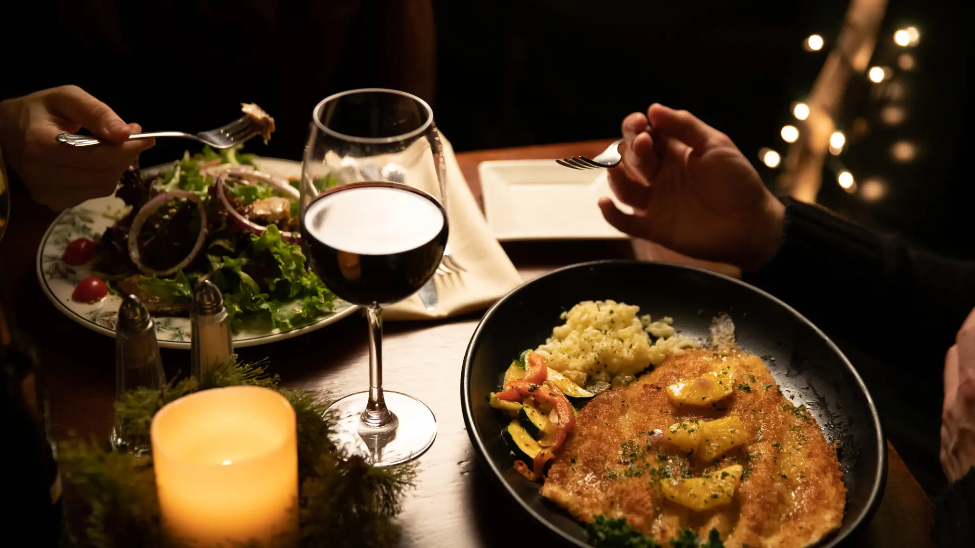 A high end meal of wine and fish.