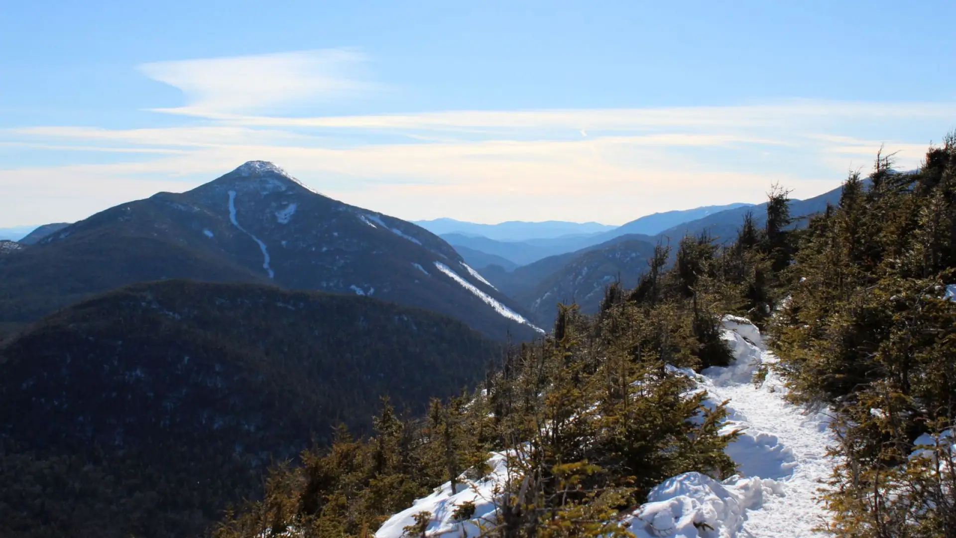 A panorama of mountains opens up just before the summit.