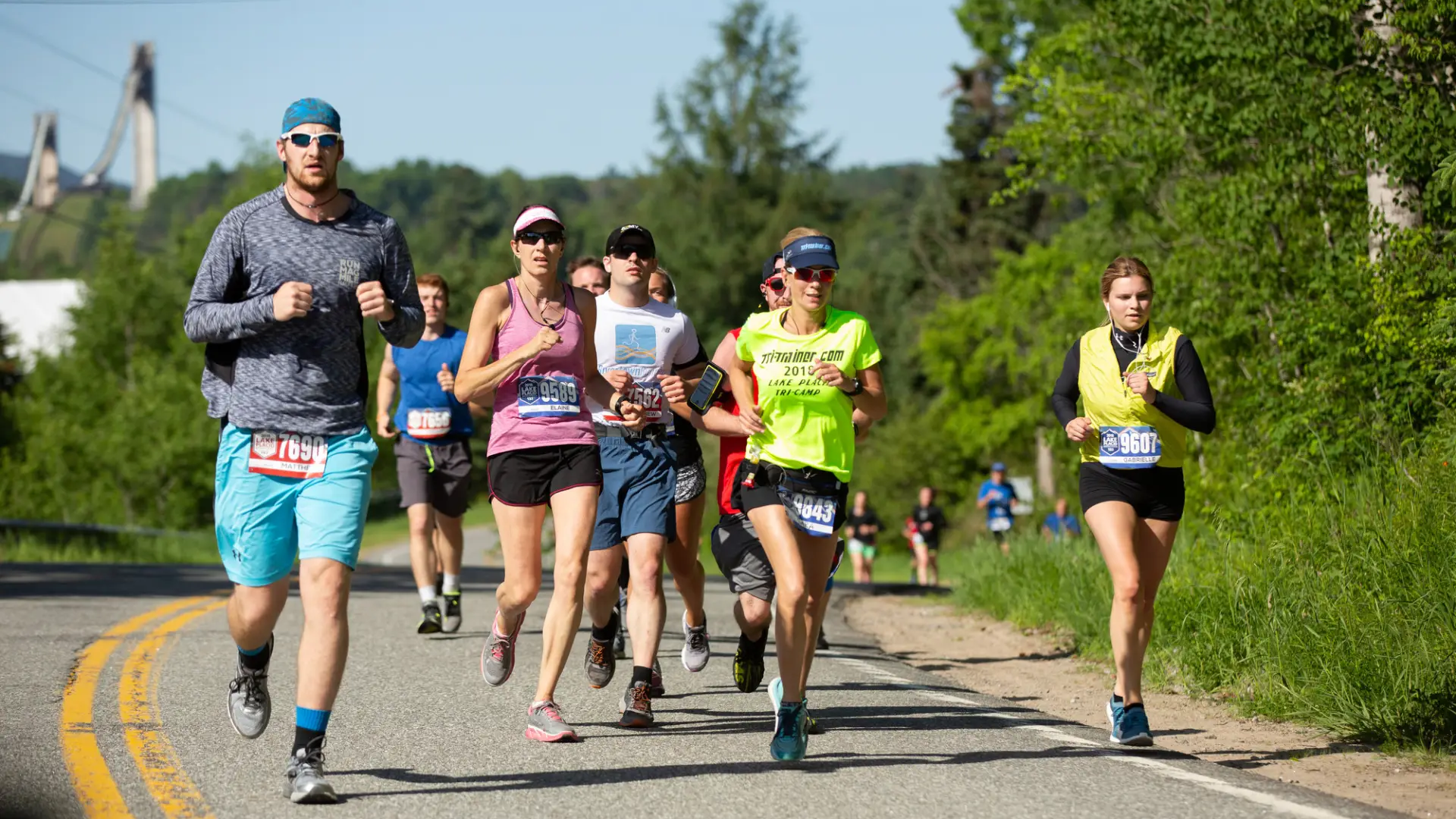 A group of runners run in a race. 