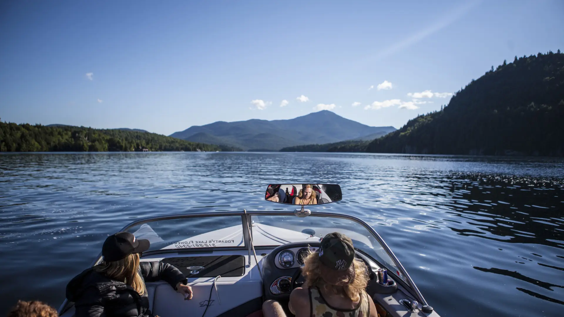 A group of people ride in a boat 