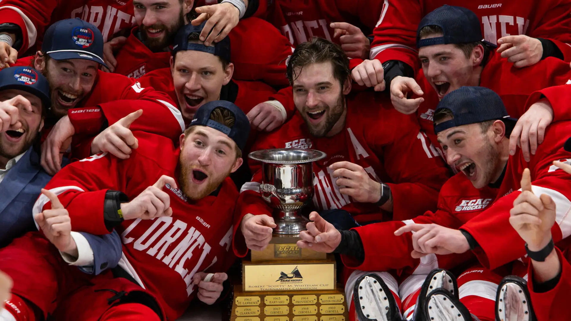 The image captures a close-up of hands reaching out, wearing red hockey gloves. 