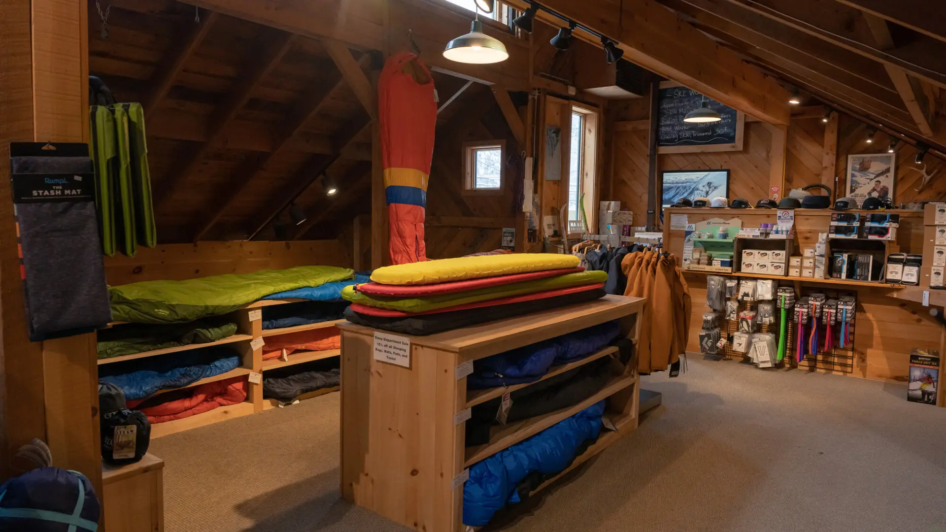A table of sleeping gear in a gear shop