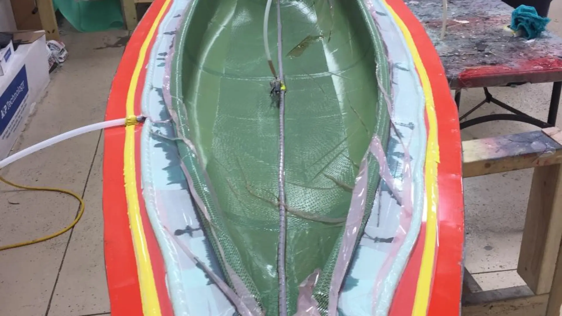 Vacuum infused system that is used to build the boats.