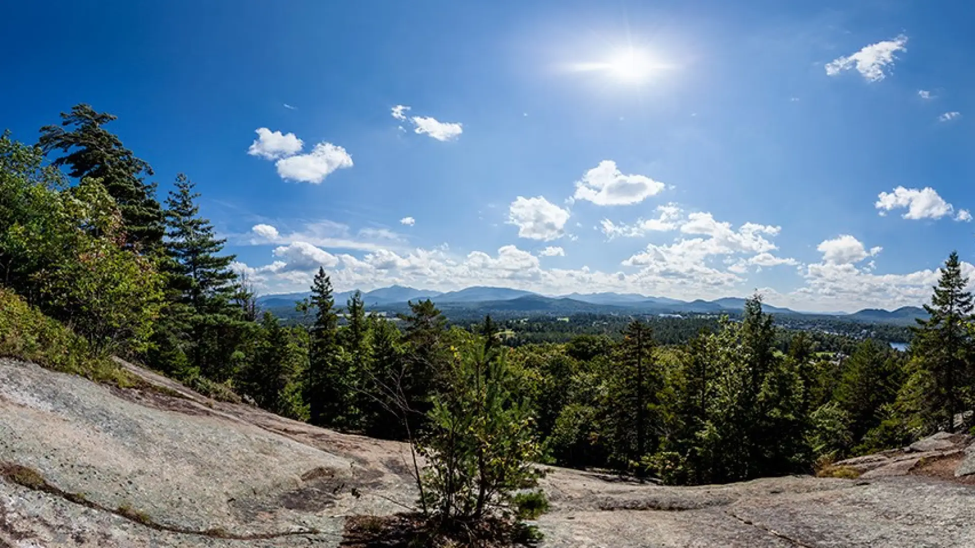 View of distant mountain ranges from the top of Cobble Hill on a sunny day.
