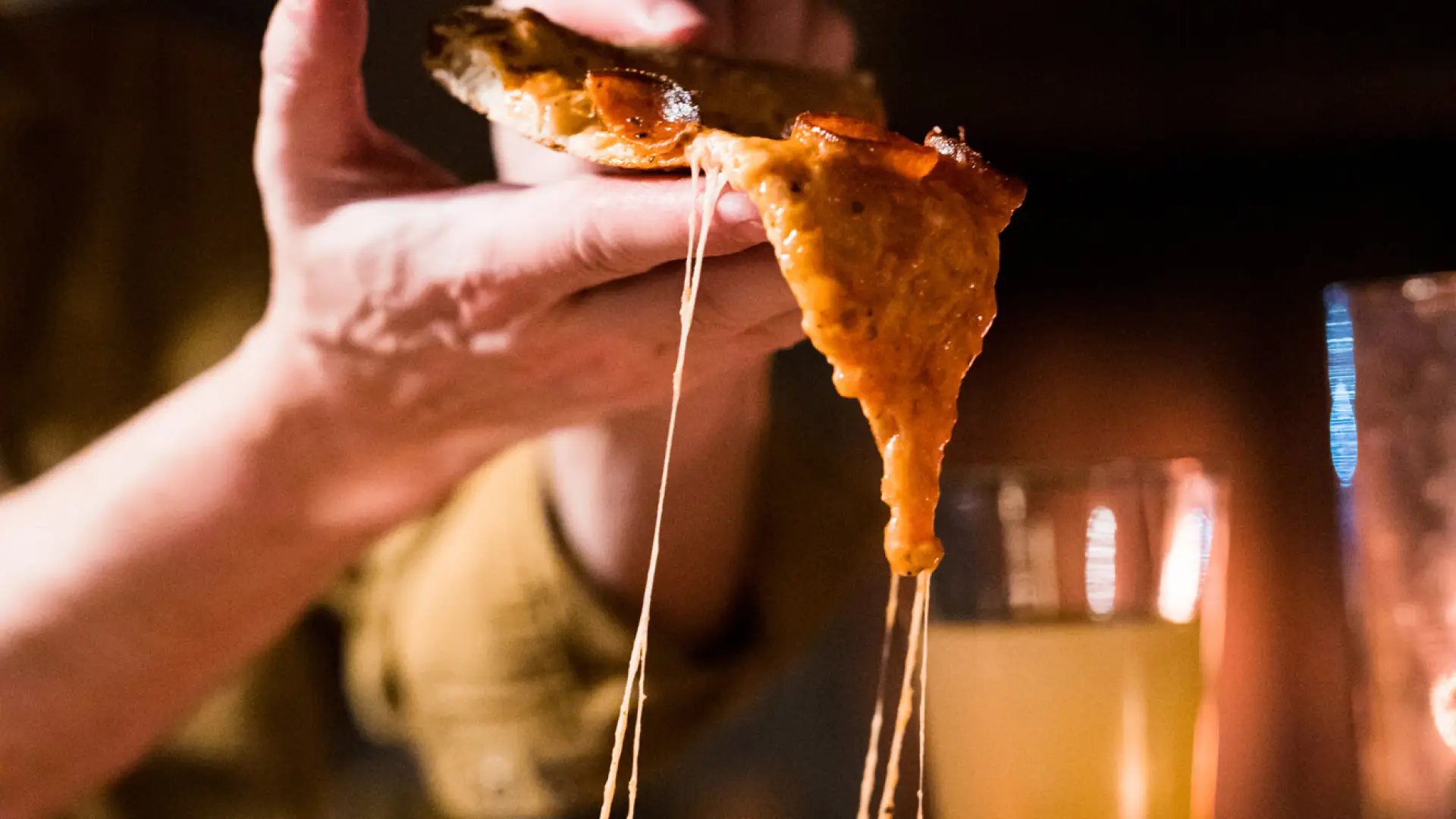 A slice of pizza from a dish. 