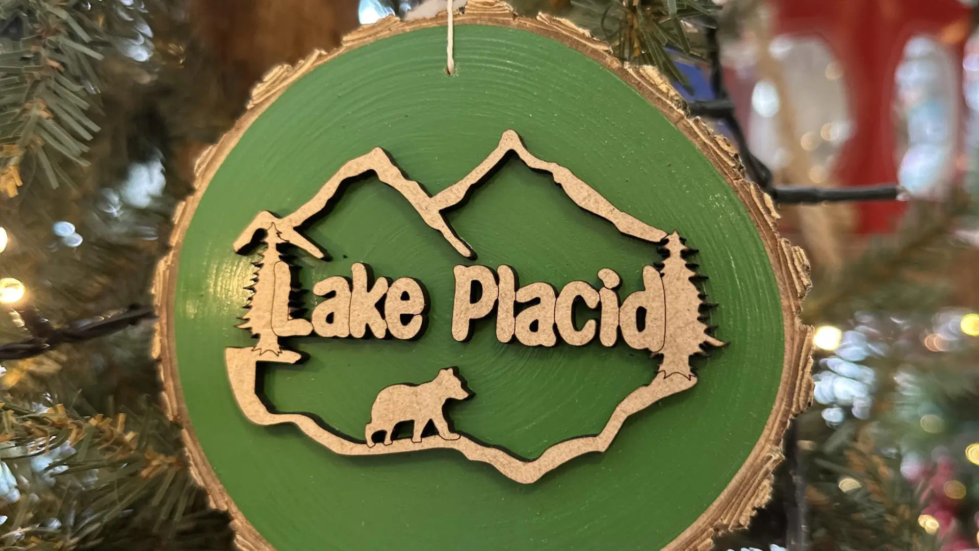 An ornament made of a log with Lake Placid written on it