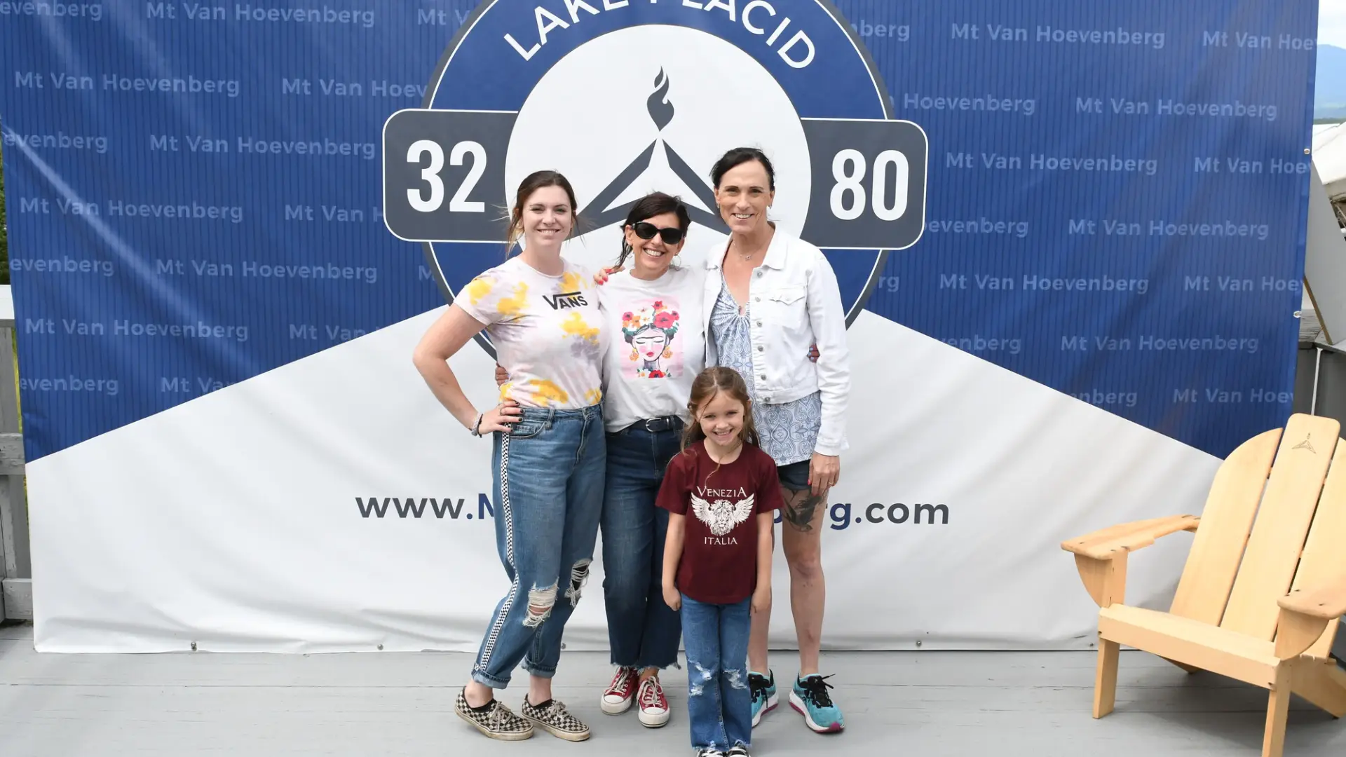 Family poses after finishing the bobsled experience