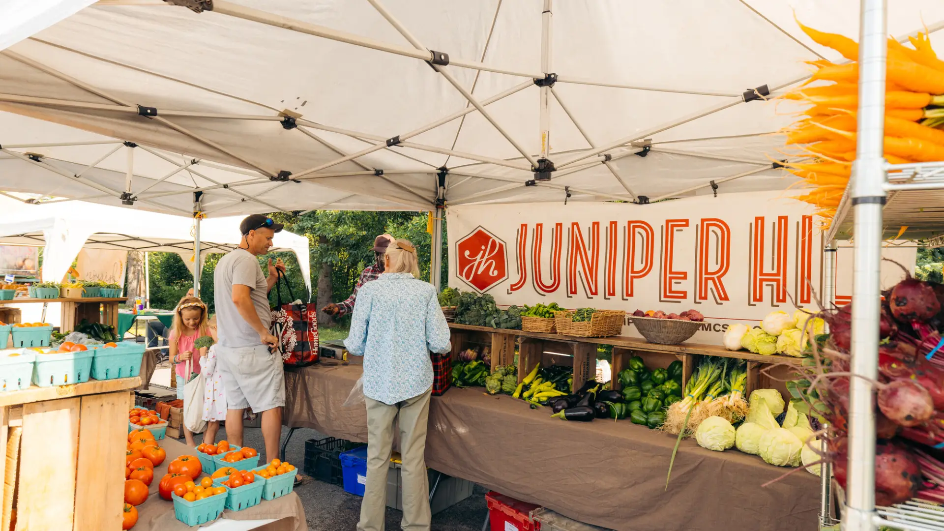 A couple explores a farmers market.