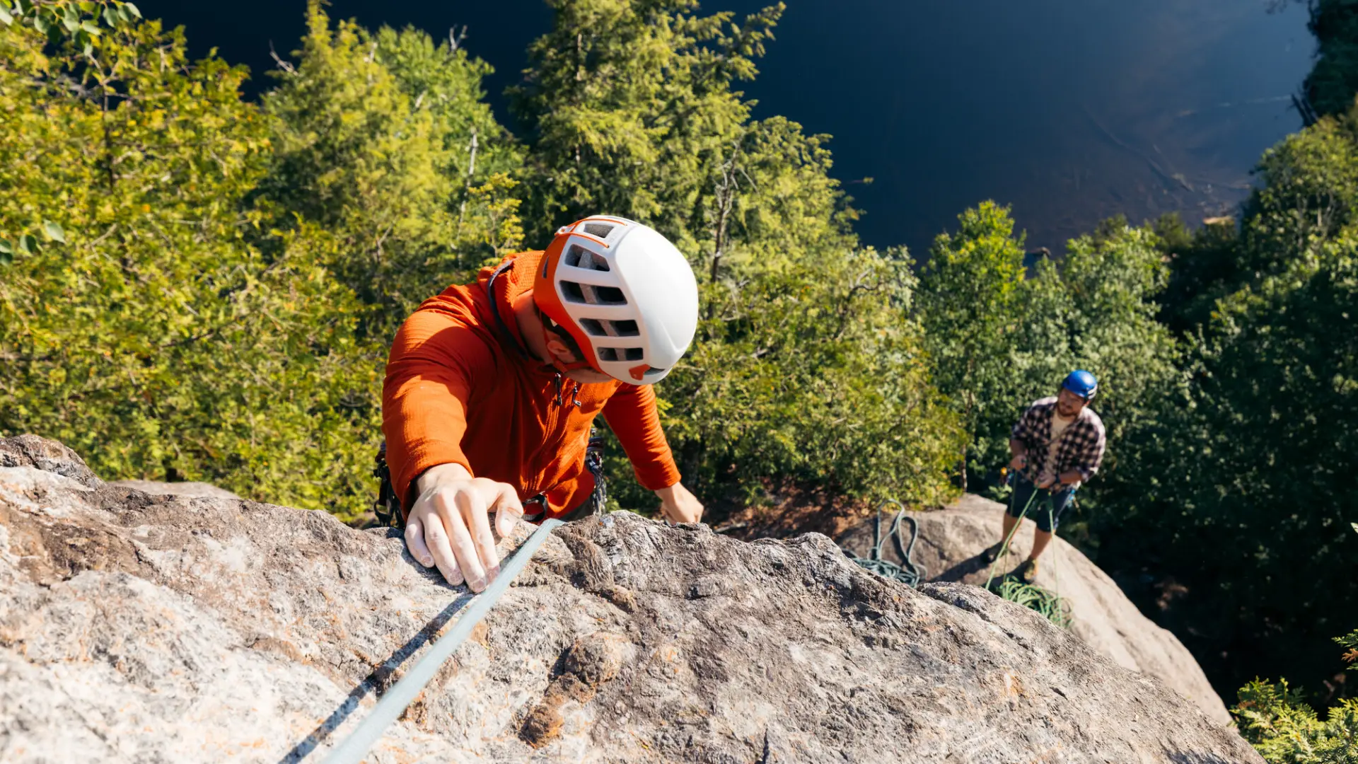 Two climbers on a multi-pitch route above Chapel Pond