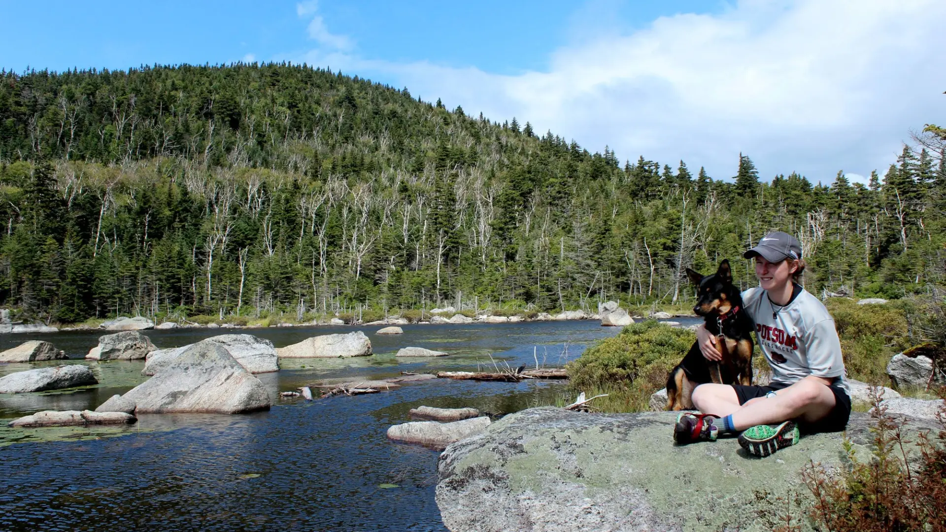 Hiker and dog enjoying Cooper Kiln Pond