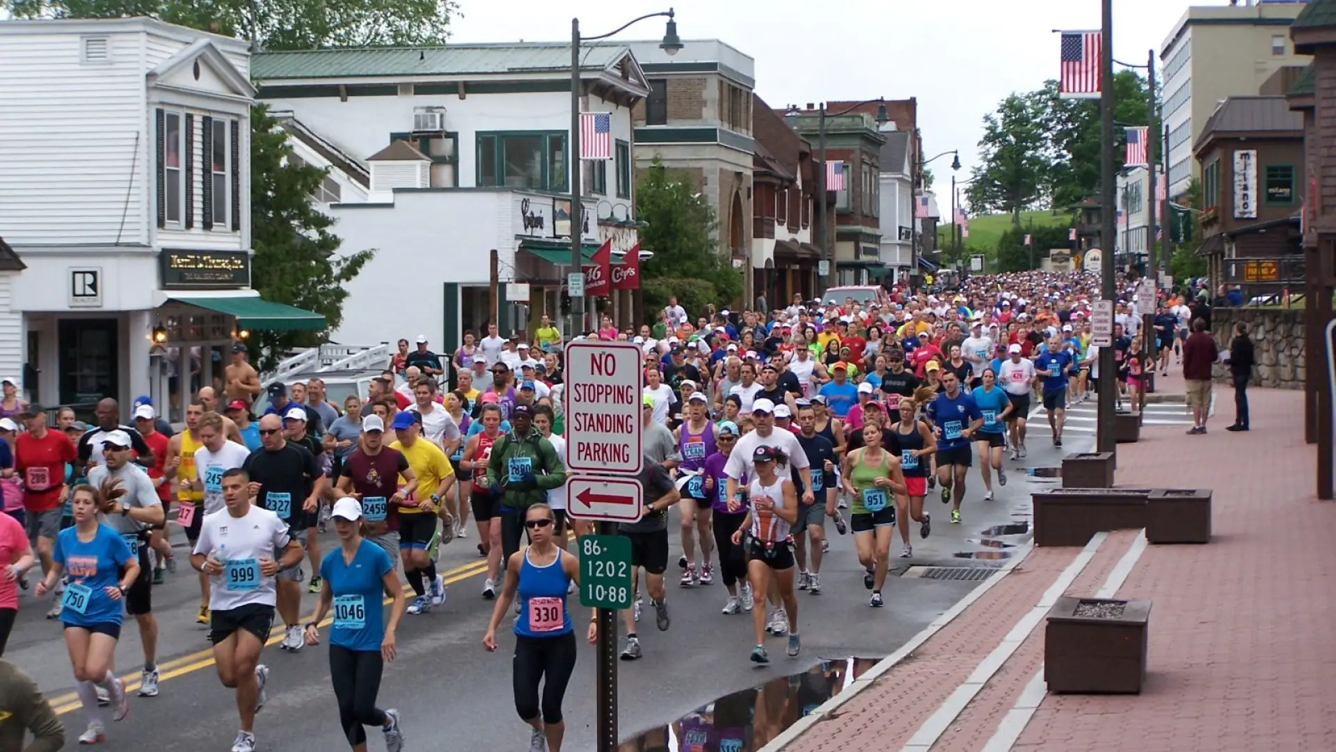Runners in the Lake Placid Marathon engulf Main Street at the beginning of the race