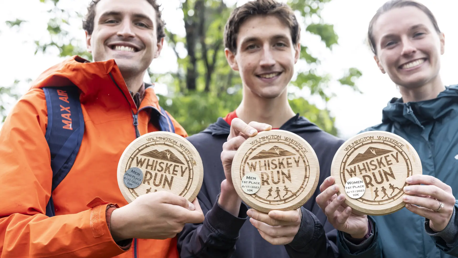 Whiskey Run winners hold up plaques