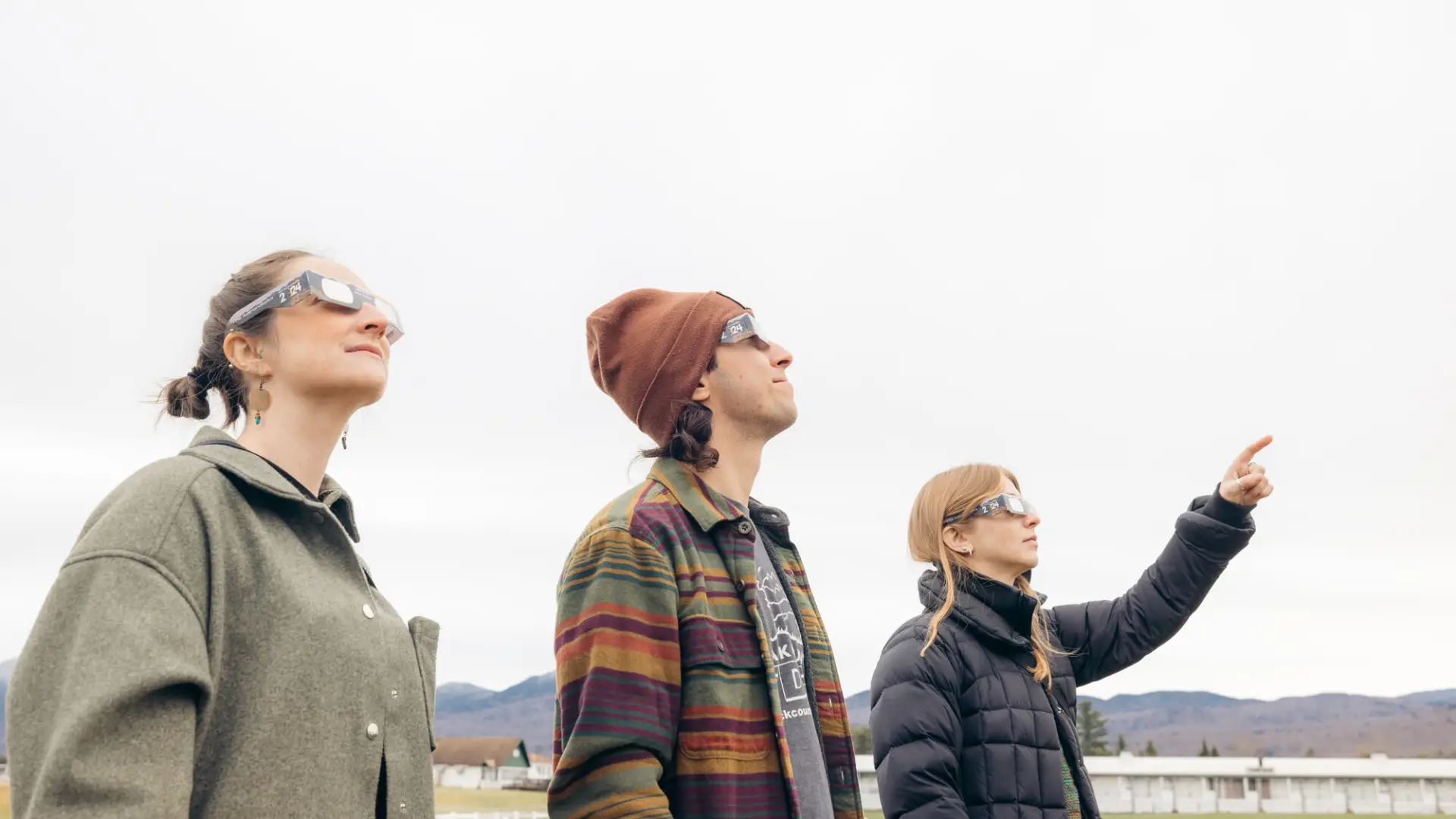 A group of people watching a solar eclipse.