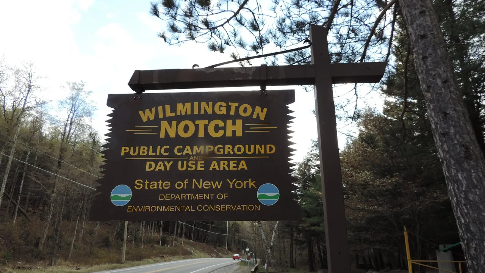 A brown and yellow sign for Wilmington Notch