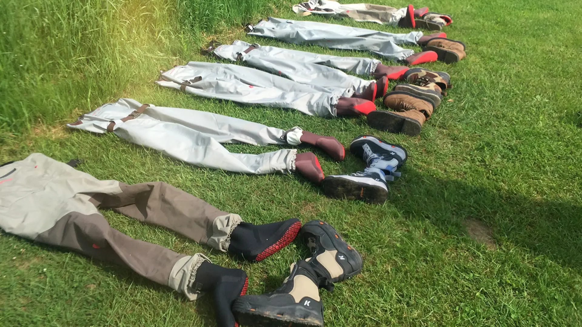 Empty waders and boots await riverwalkers.